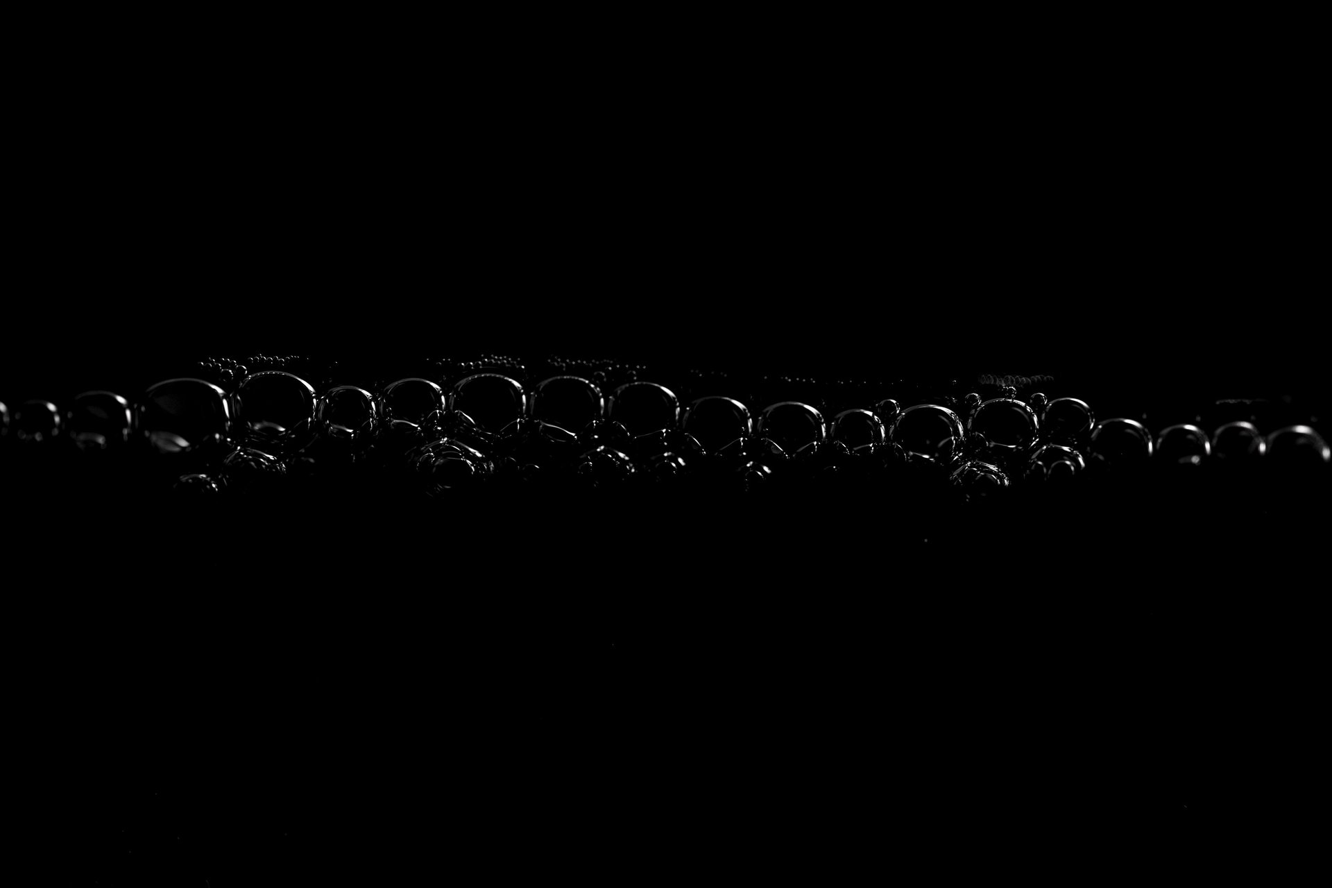 an abstract photo of a curved building with a blue sky in the background