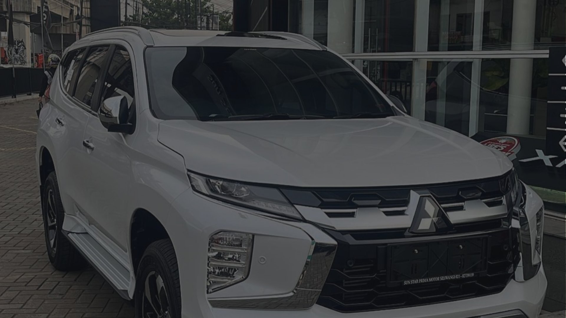an abstract photo of a curved building with a blue sky in the background