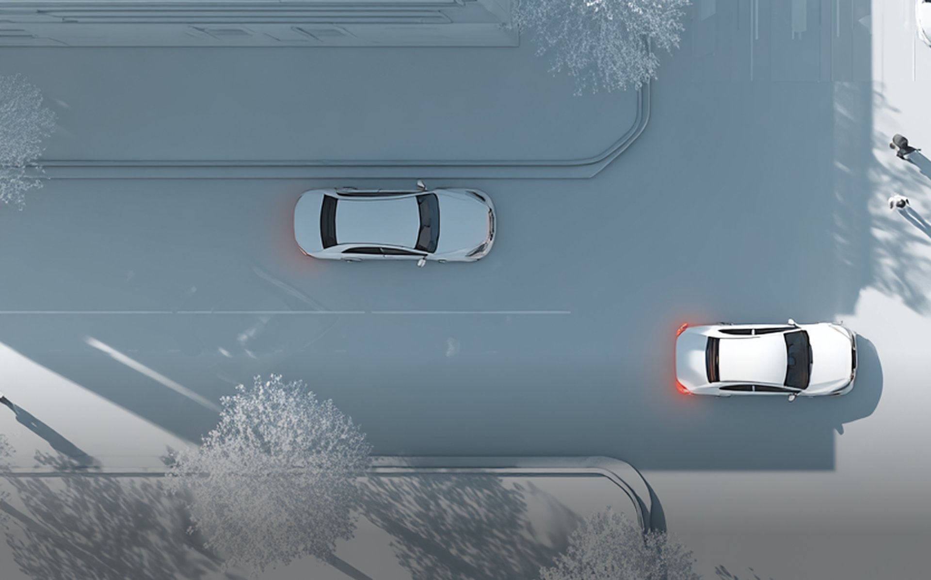 Aerial view of vehicles on an urban street, representing incident reconstruction and claims assessment.