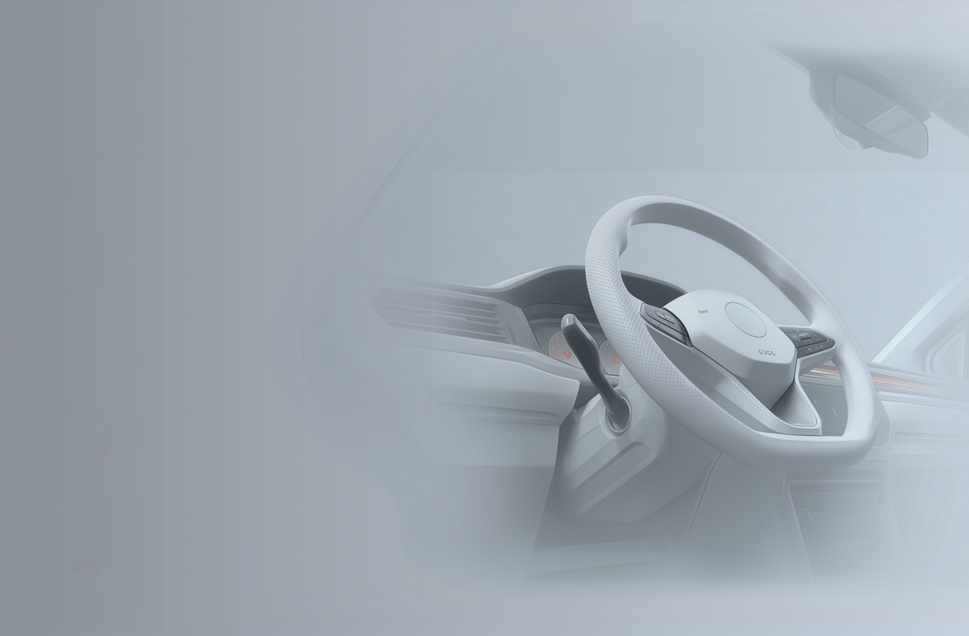 Close-up of a car steering wheel and dashboard, representing in-vehicle reporting and digital claims handling.