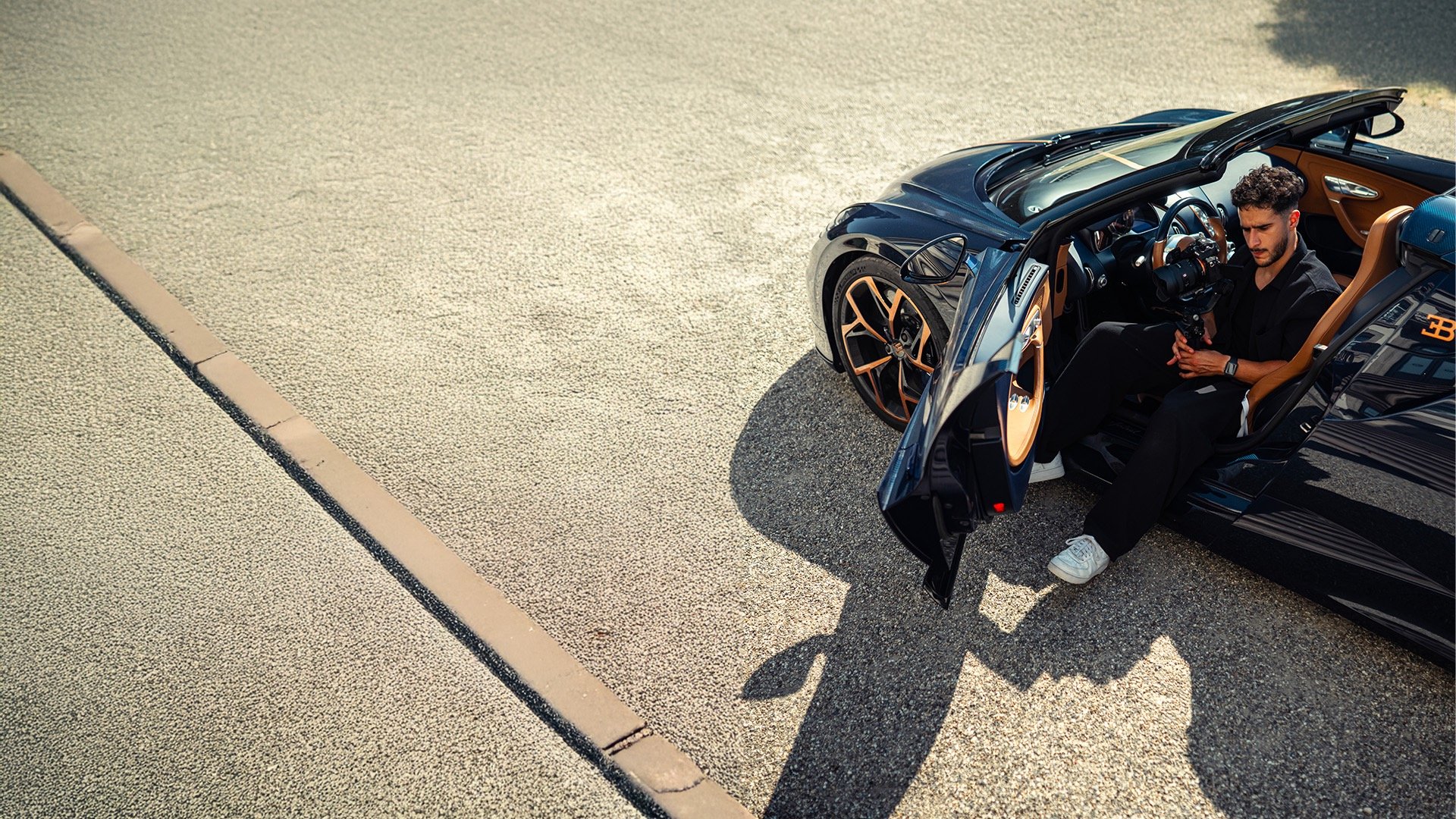 an abstract photo of a curved building with a blue sky in the background