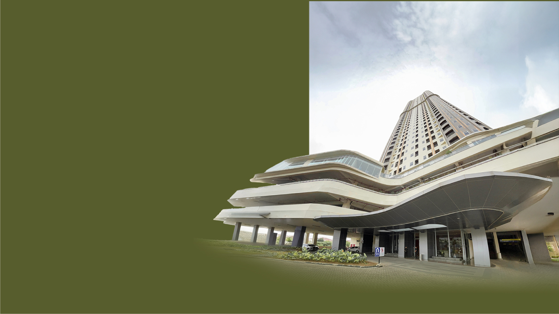 an abstract photo of a curved building with a blue sky in the background