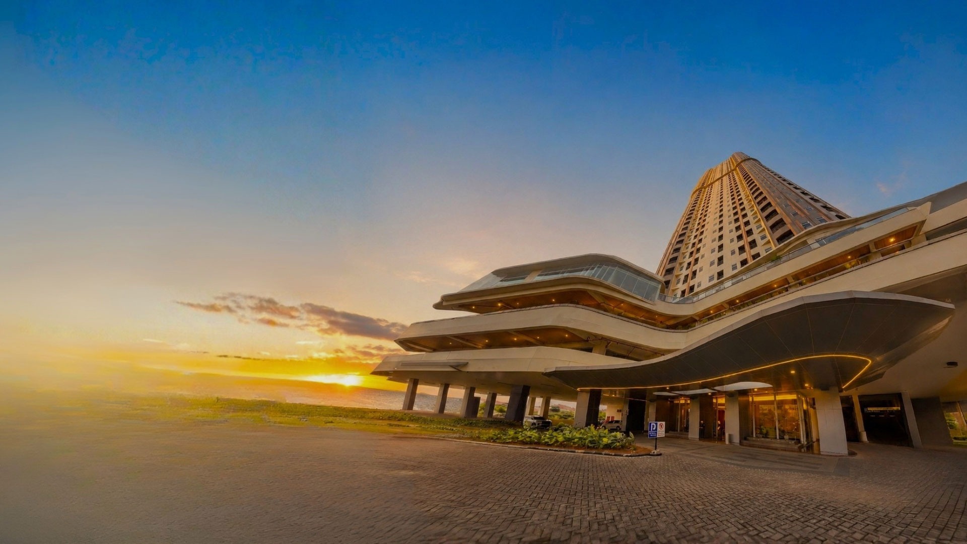 an abstract photo of a curved building with a blue sky in the background