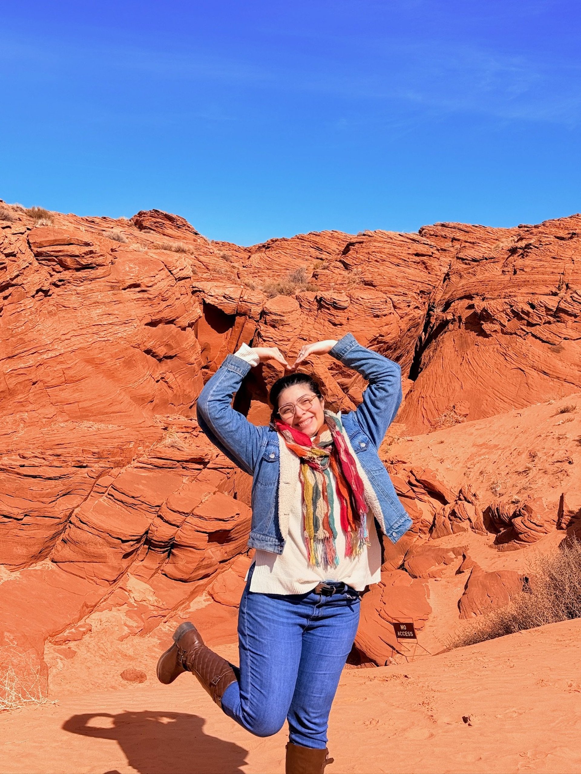 an abstract photo of a curved building with a blue sky in the background