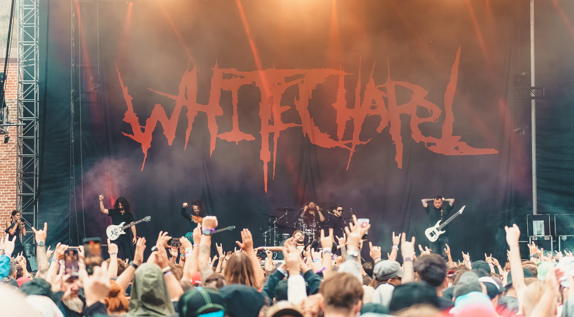 woman wearing yellow long-sleeved dress under white clouds and blue sky during daytime
