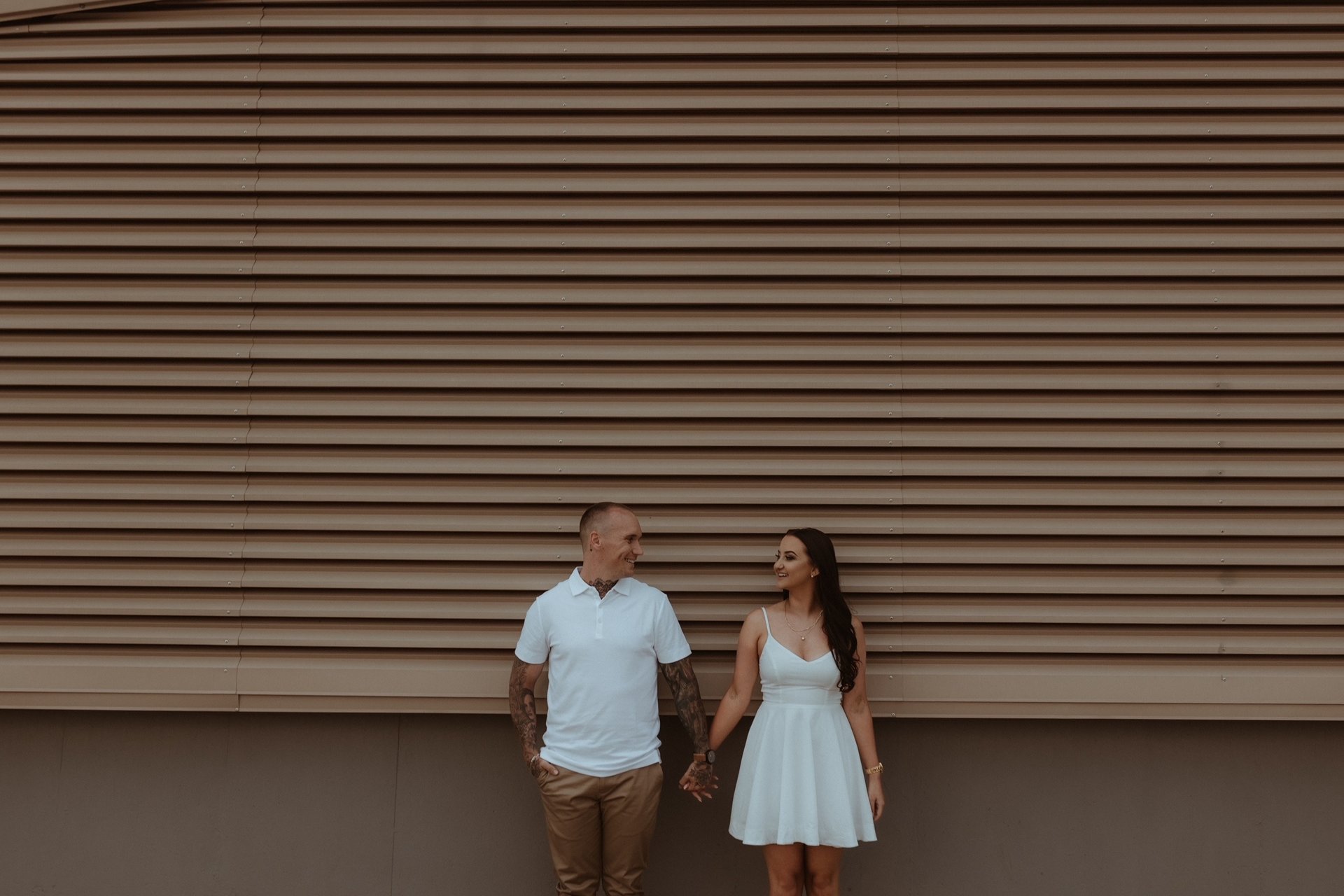 couple wearing silver-colored rings