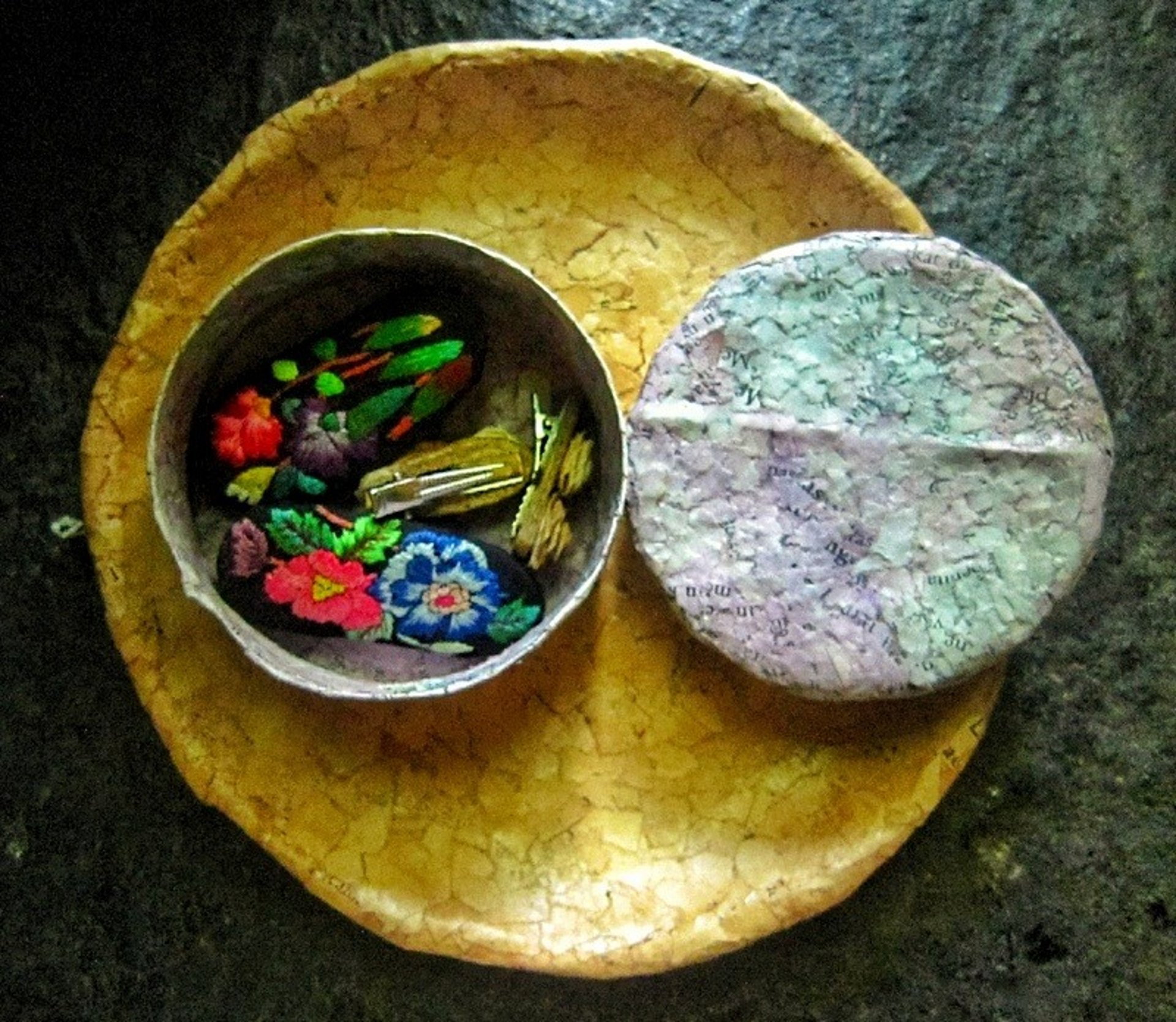 Recycled paper purple jewelry case opened on recycle paper brown plae