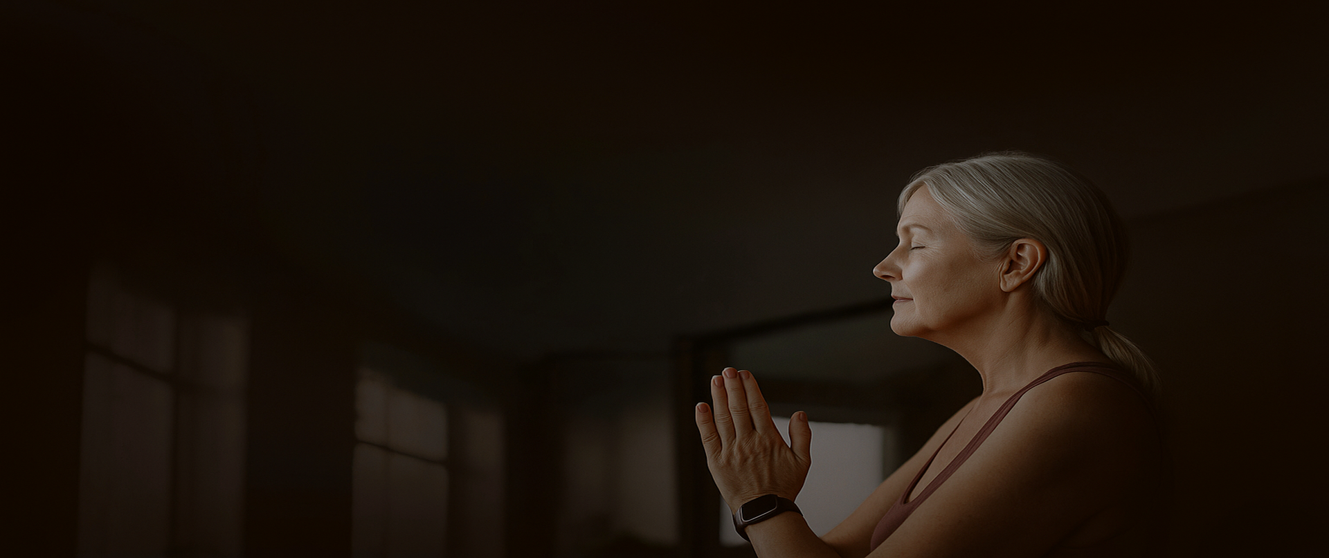 black and brown rotary phone near gray wall