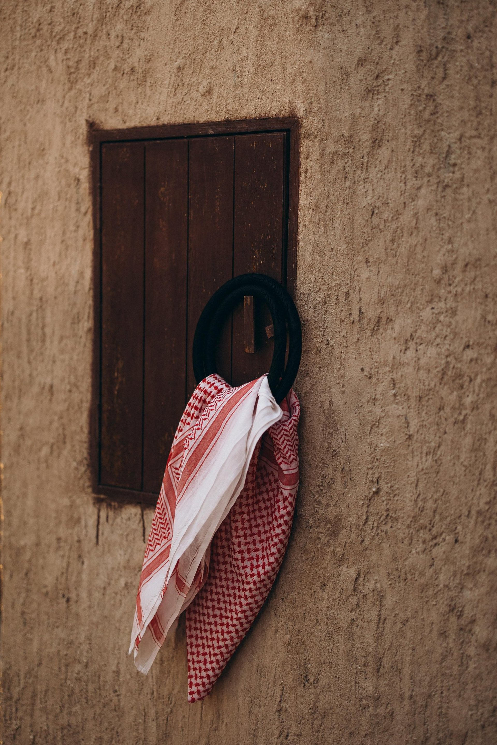 woman wearing yellow long-sleeved dress under white clouds and blue sky during daytime