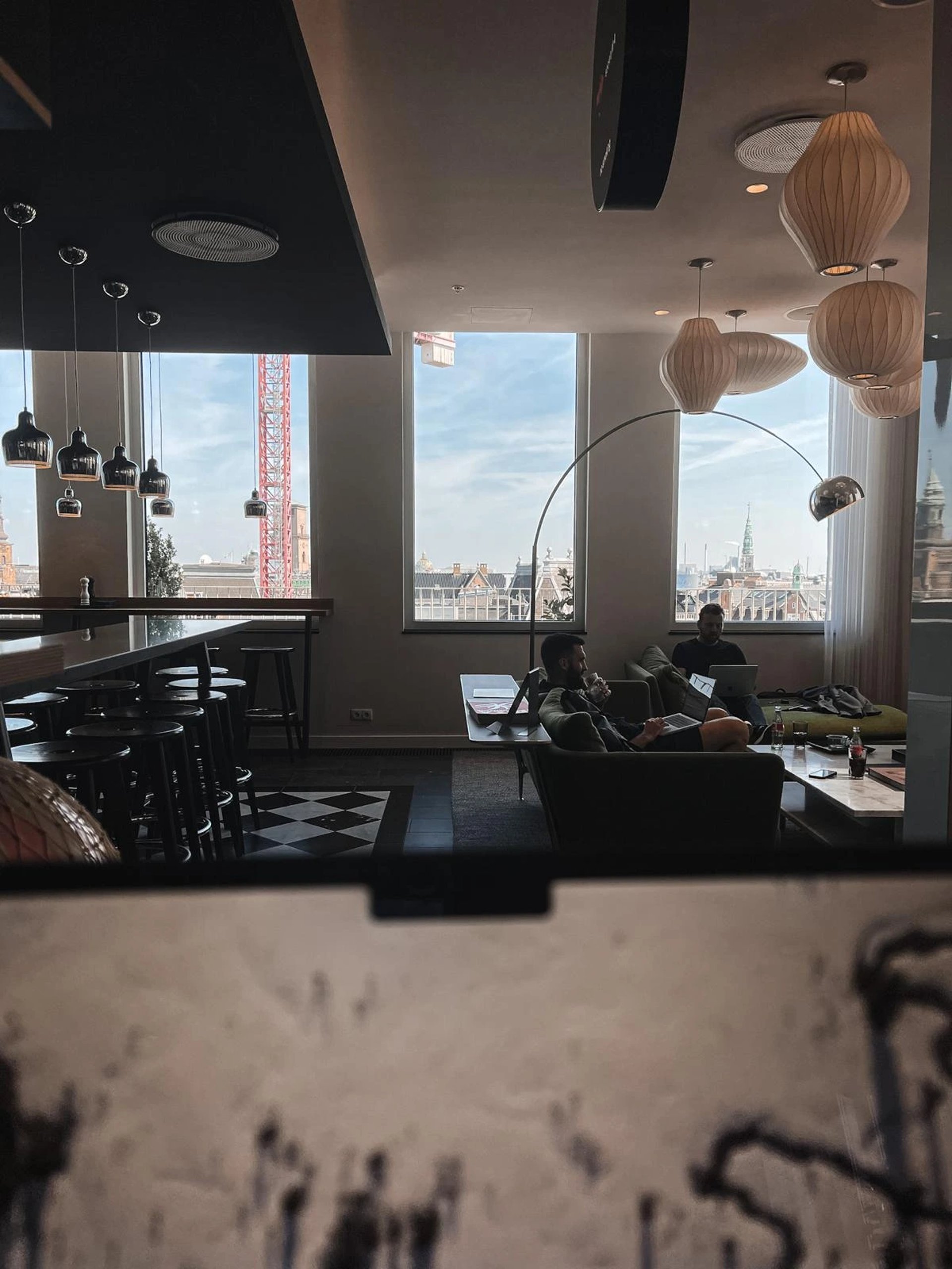 an abstract photo of a curved building with a blue sky in the background