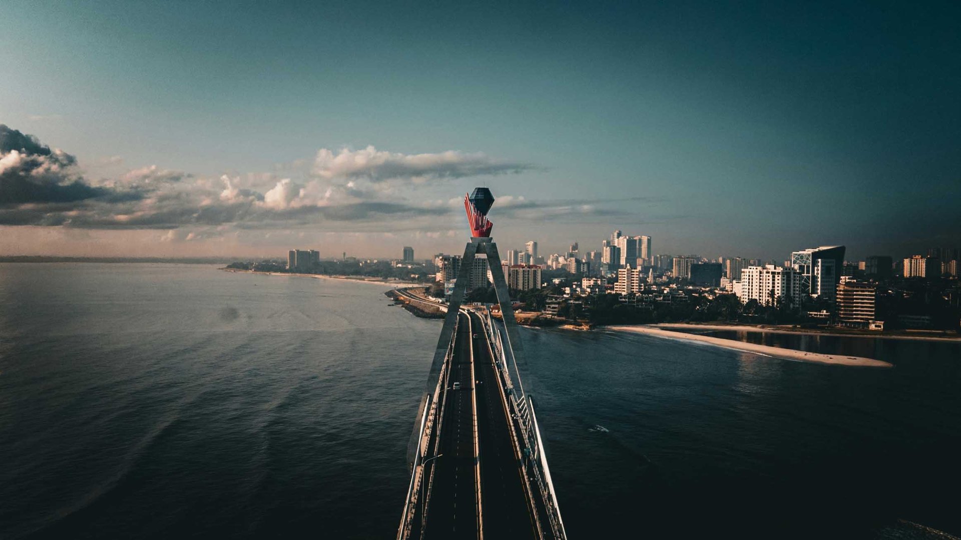 woman wearing yellow long-sleeved dress under white clouds and blue sky during daytime