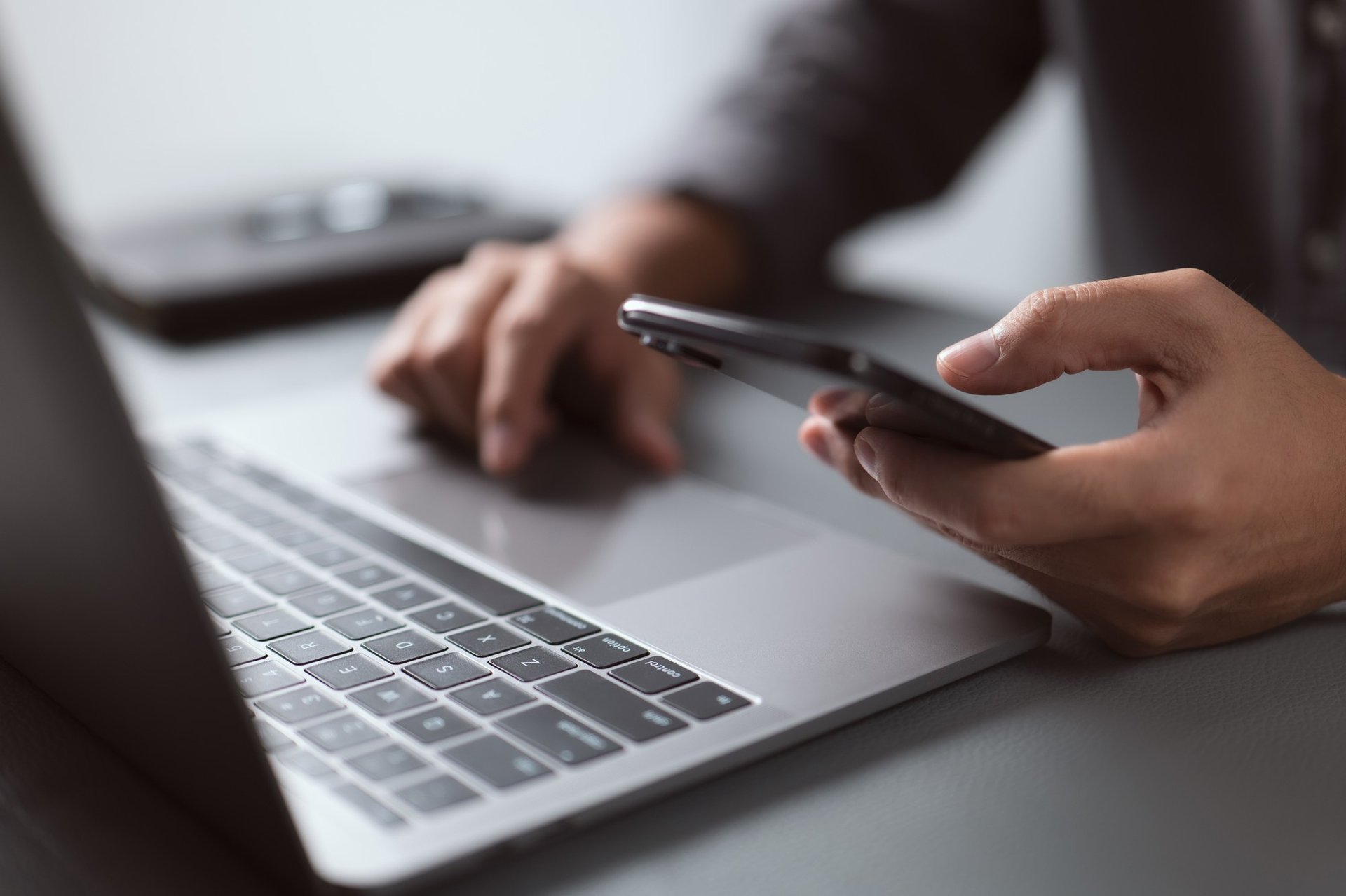 man operating the MacBook Pro