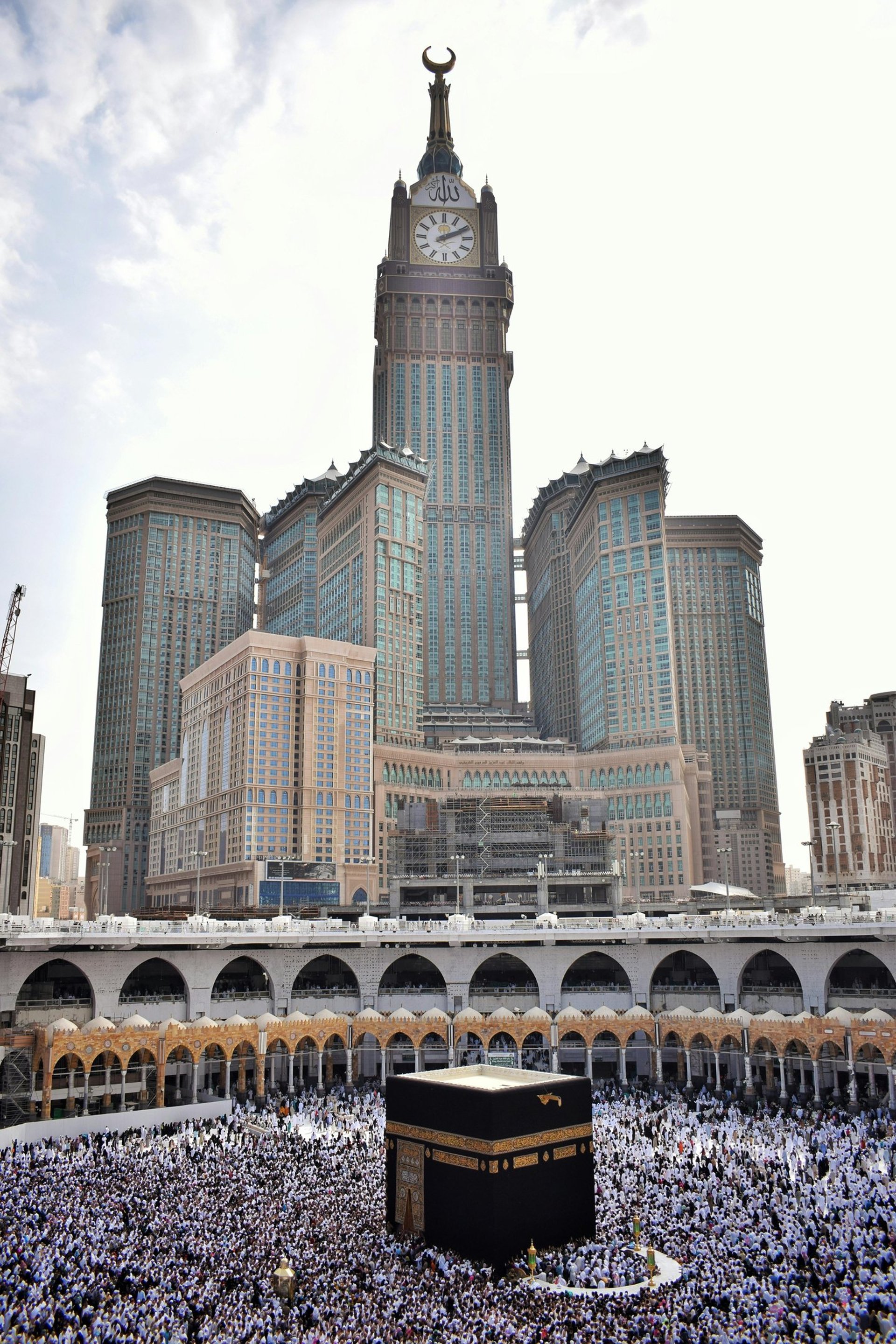 an abstract photo of a curved building with a blue sky in the background