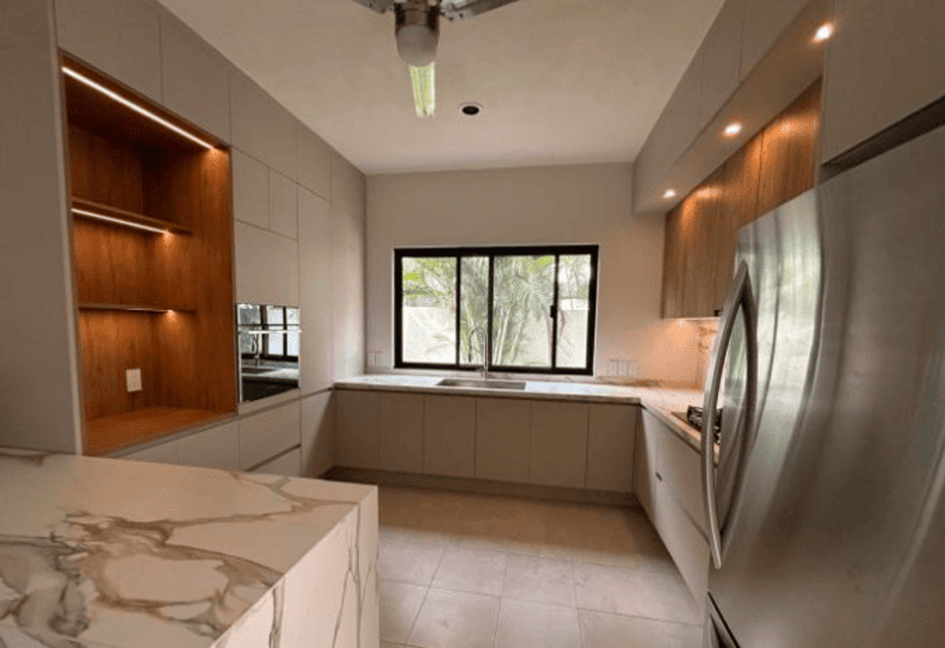 an abstract photo of a curved building with a blue sky in the background