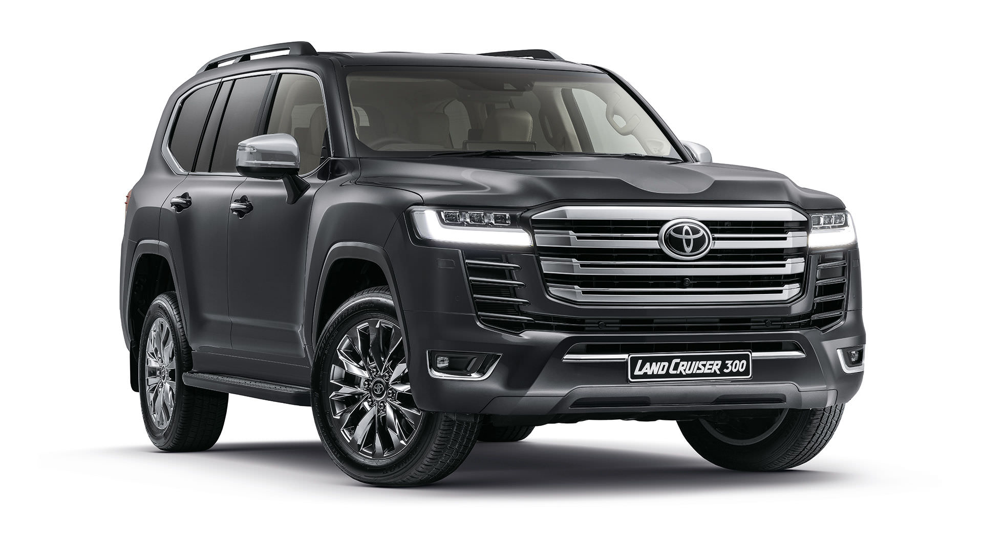 a black toyota land cruiser parked in front of a building