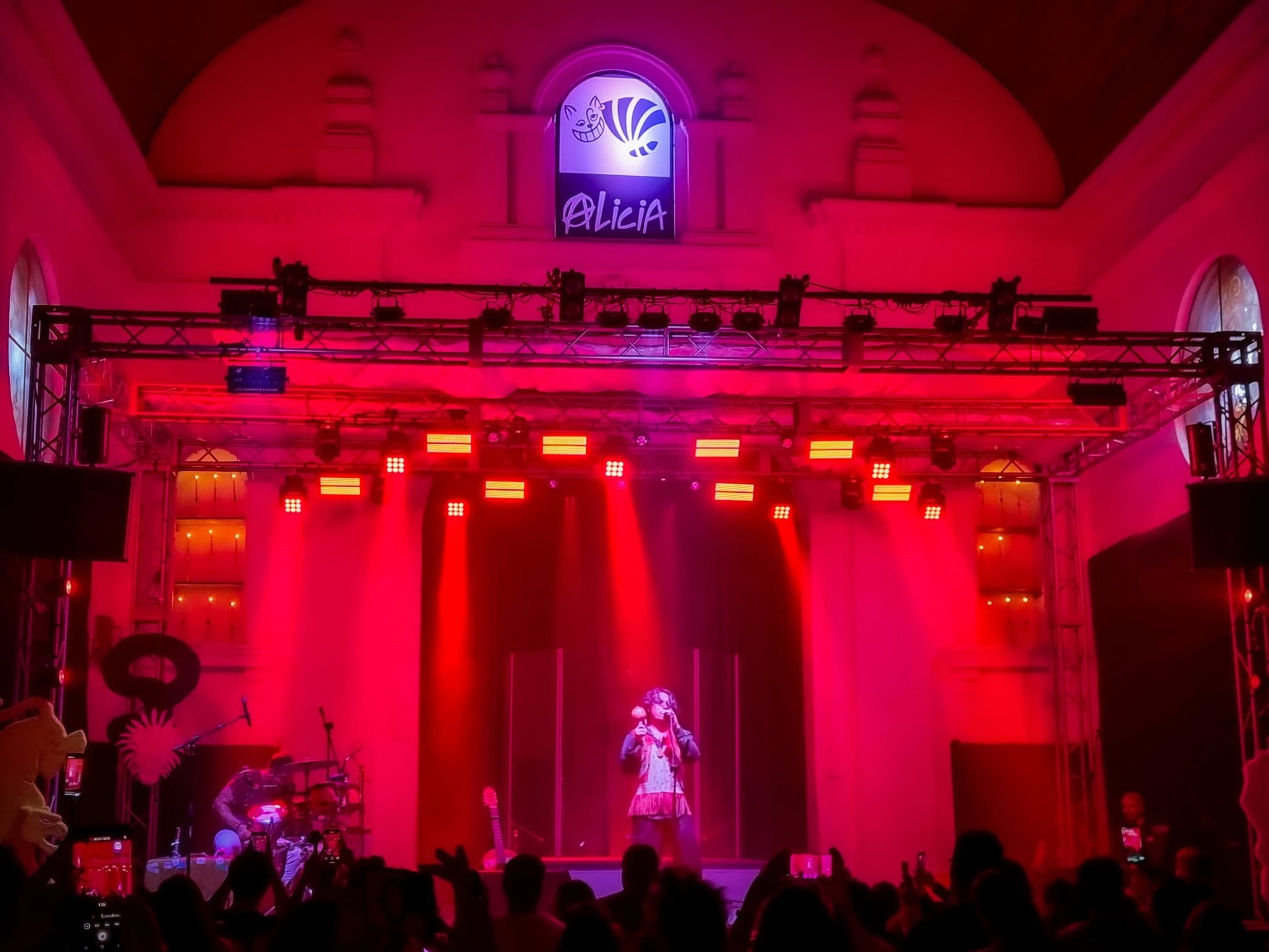 an abstract photo of a curved building with a blue sky in the background