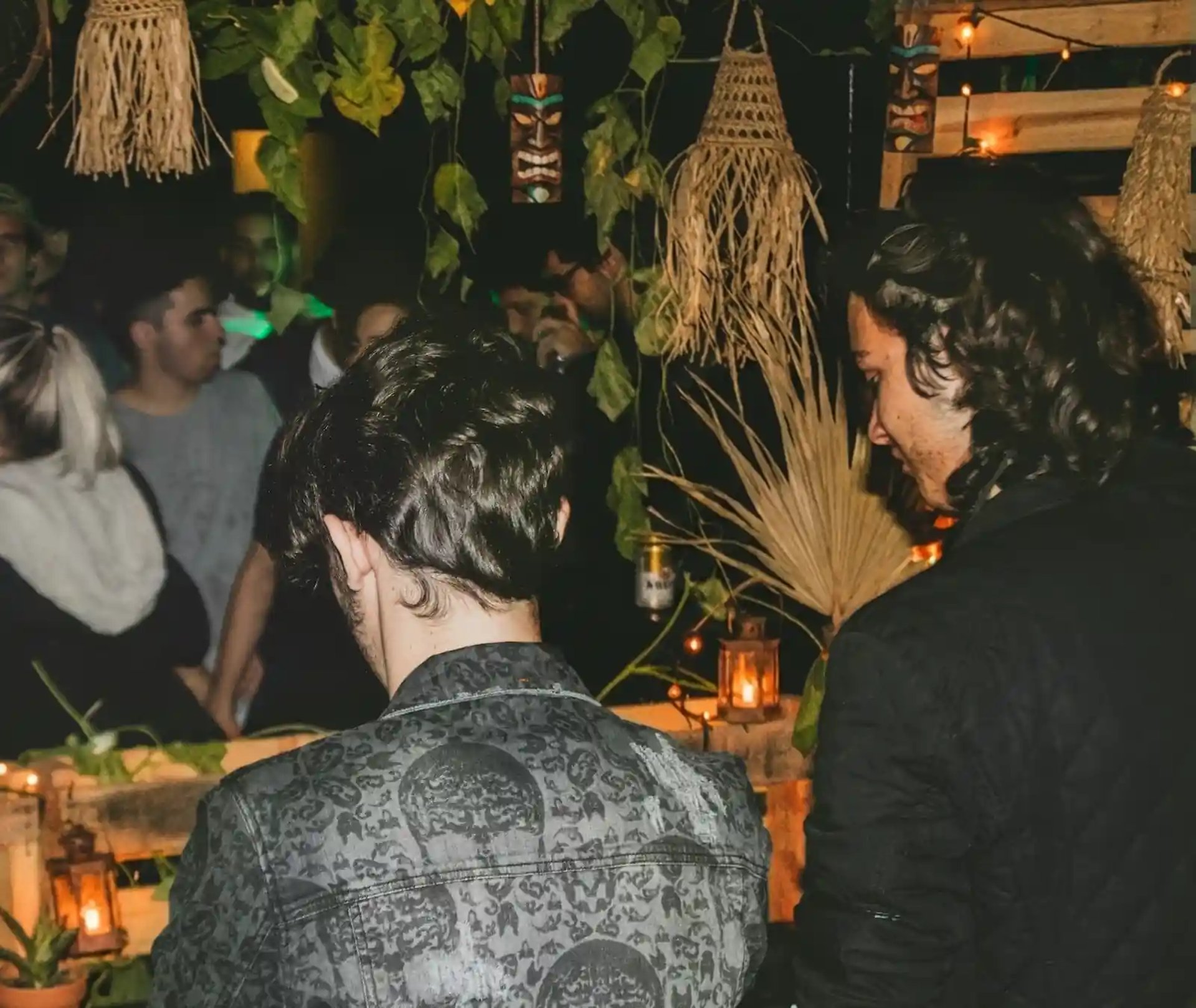 Woman in a white top and jeans at night