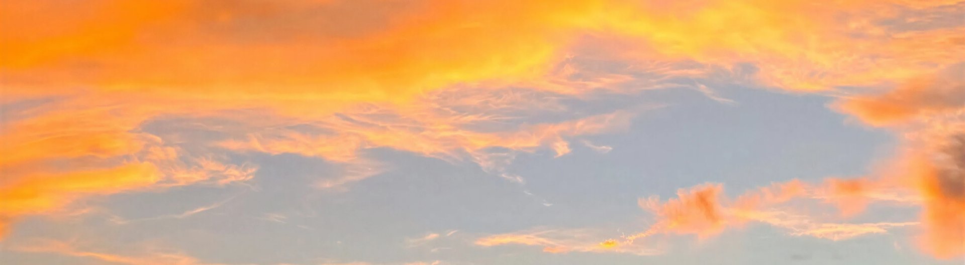 a close up of a person wearing a silver top