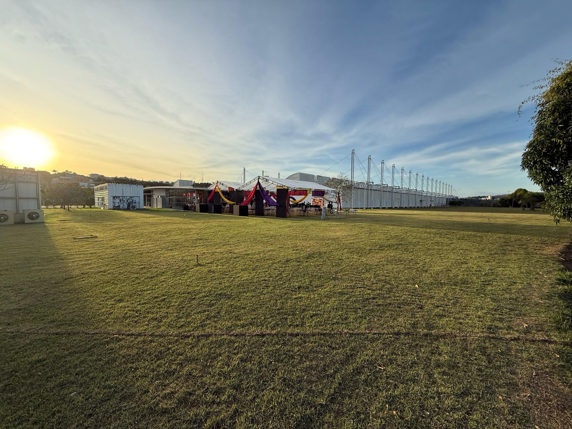 woman wearing yellow long-sleeved dress under white clouds and blue sky during daytime