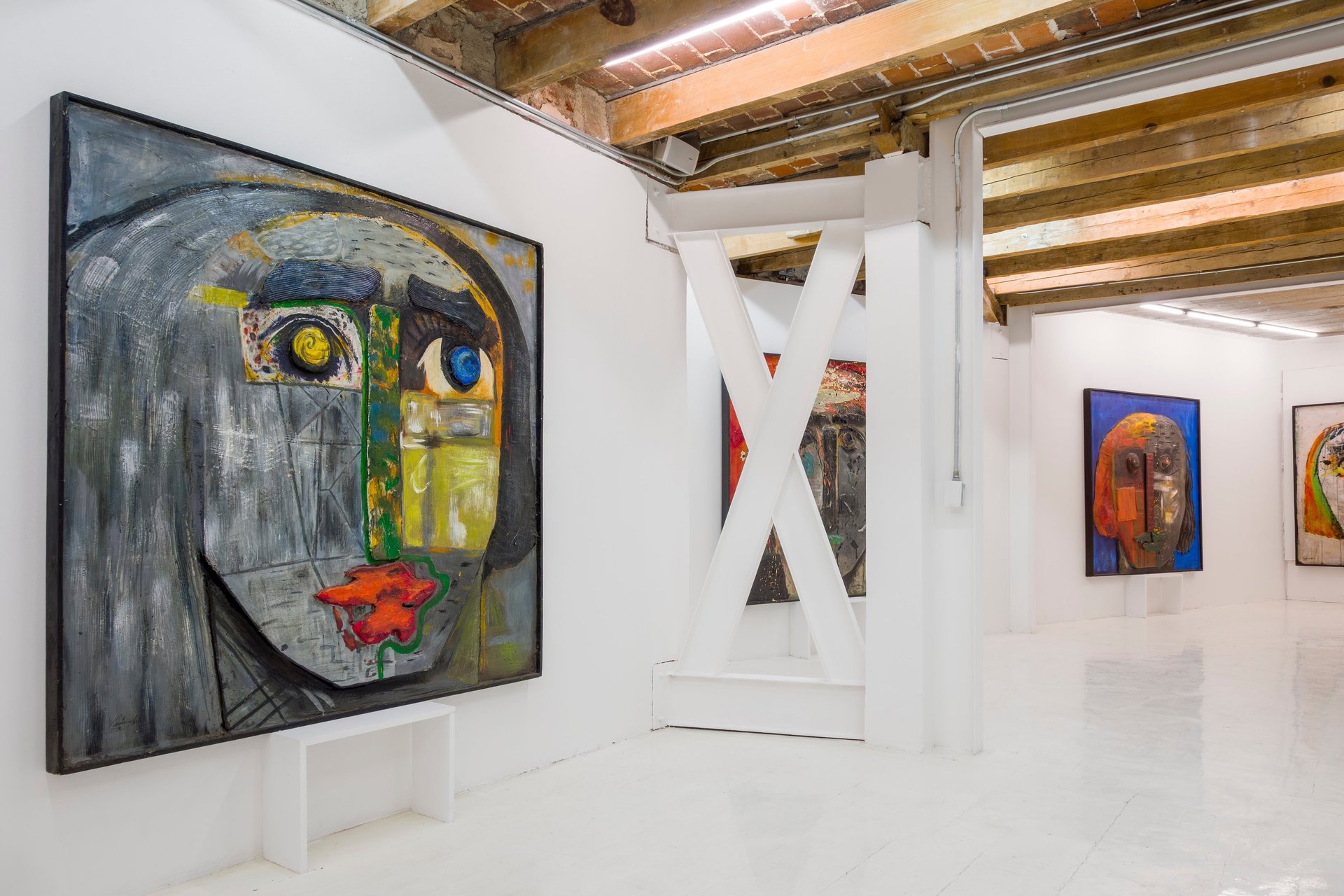 an abstract photo of a curved building with a blue sky in the background