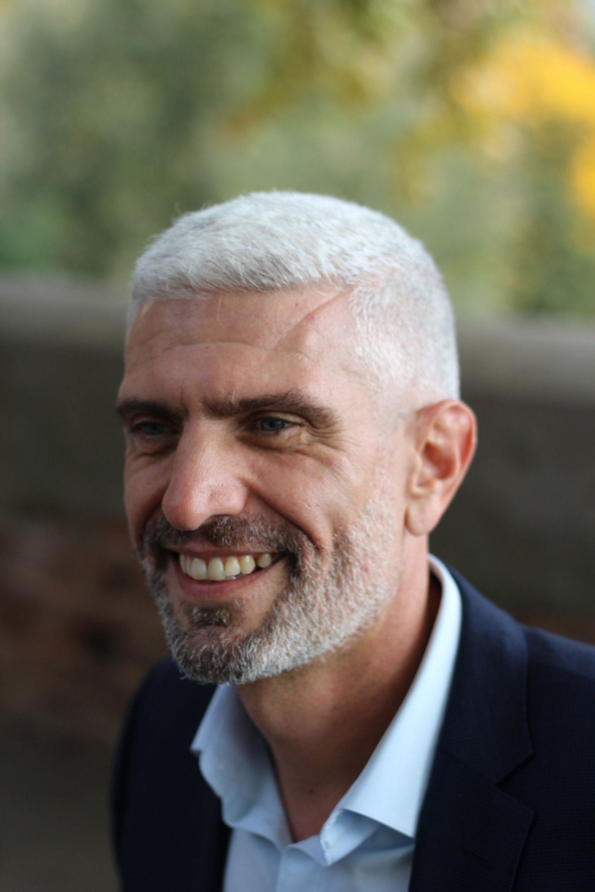 woman wearing yellow long-sleeved dress under white clouds and blue sky during daytime