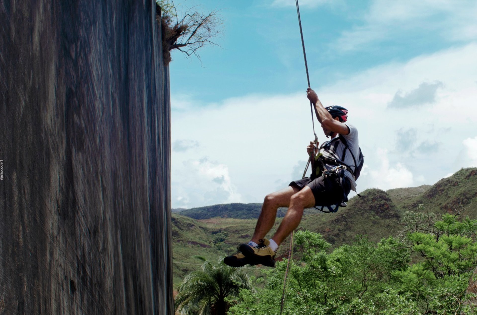 an abstract photo of a curved building with a blue sky in the background