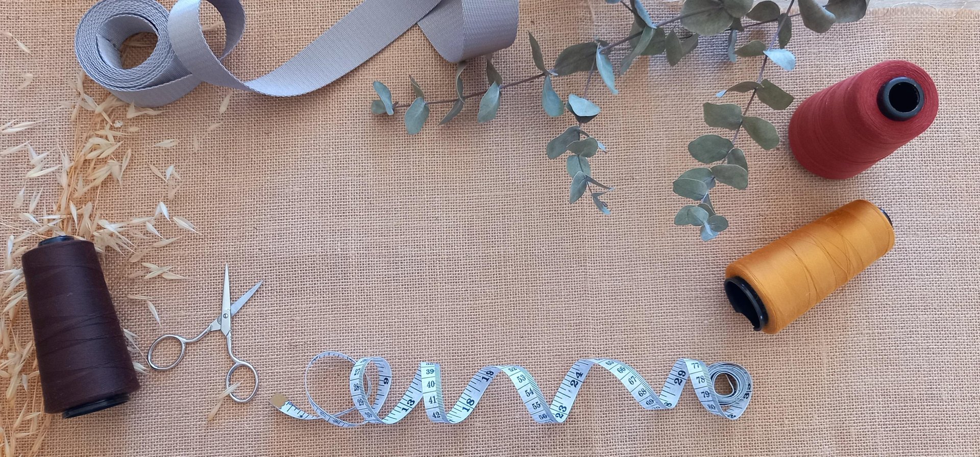 a row of spools of thread sitting next to each other