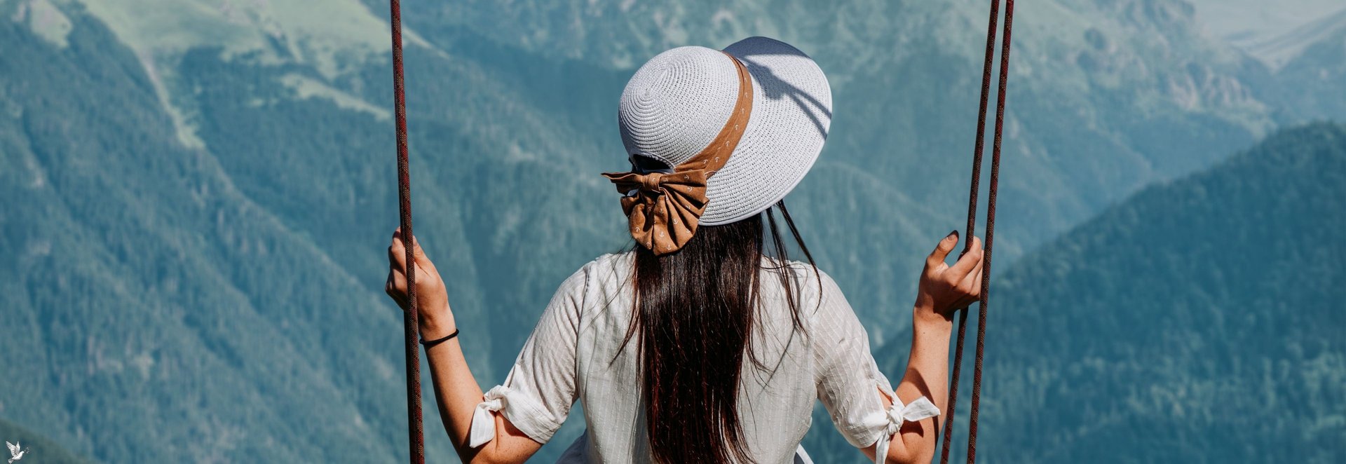 woman riding on vehicle putting her head and right arm outside the window while travelling the road
