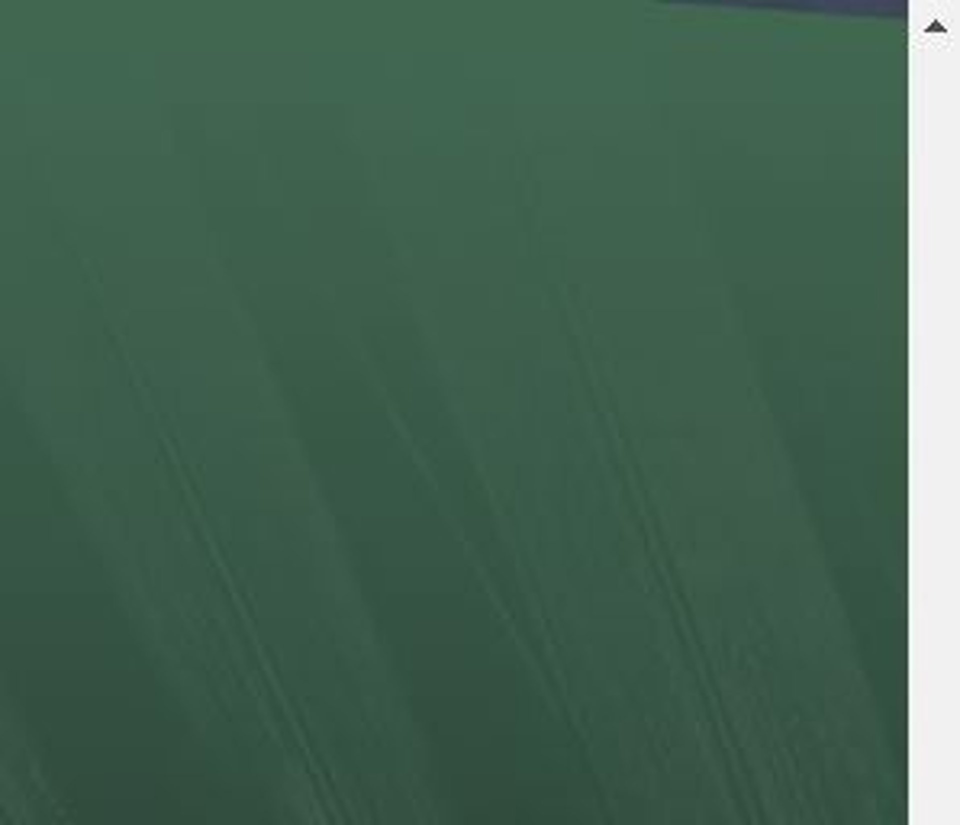 an abstract photo of a curved building with a blue sky in the background