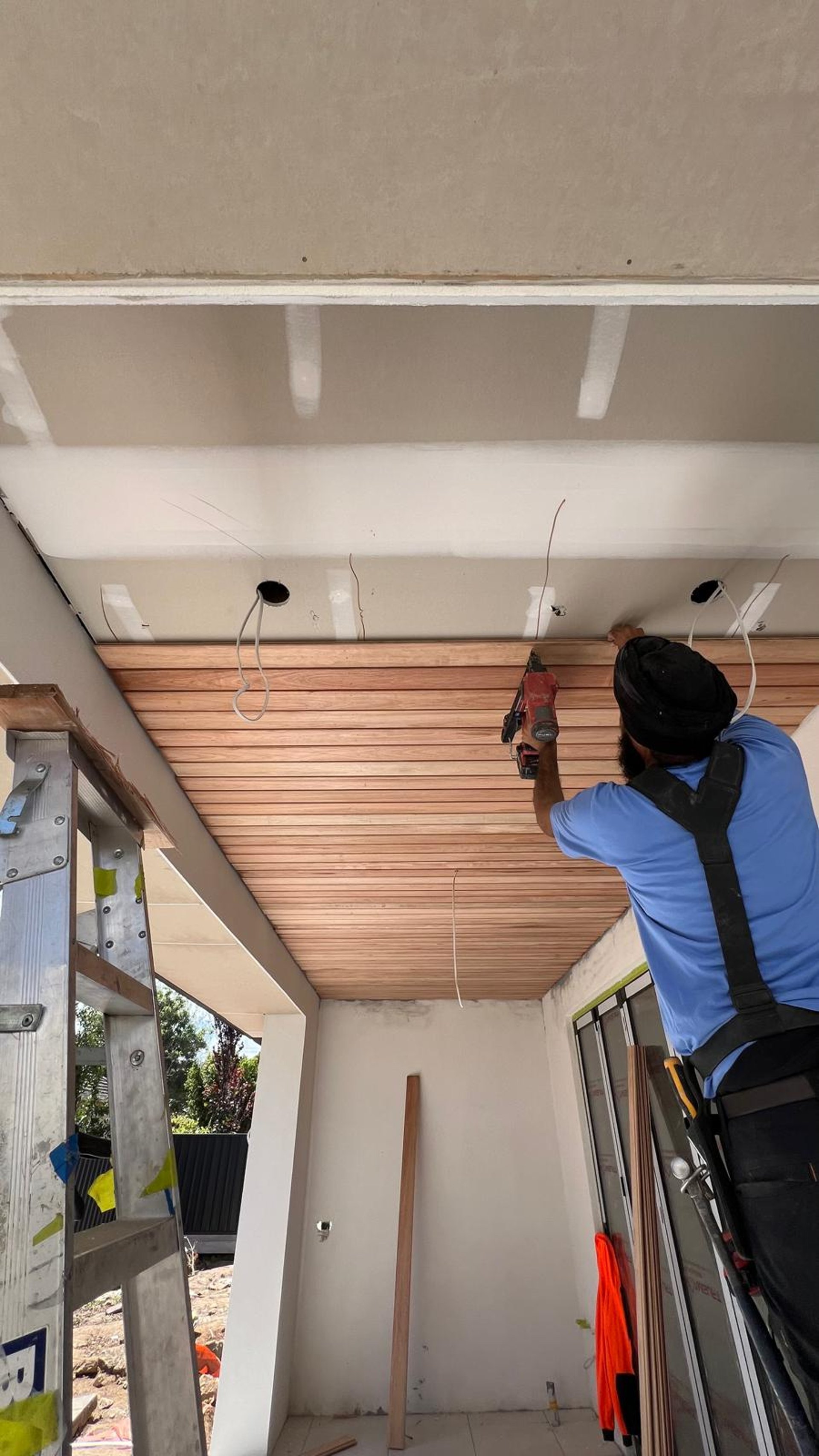 woman wearing yellow long-sleeved dress under white clouds and blue sky during daytime