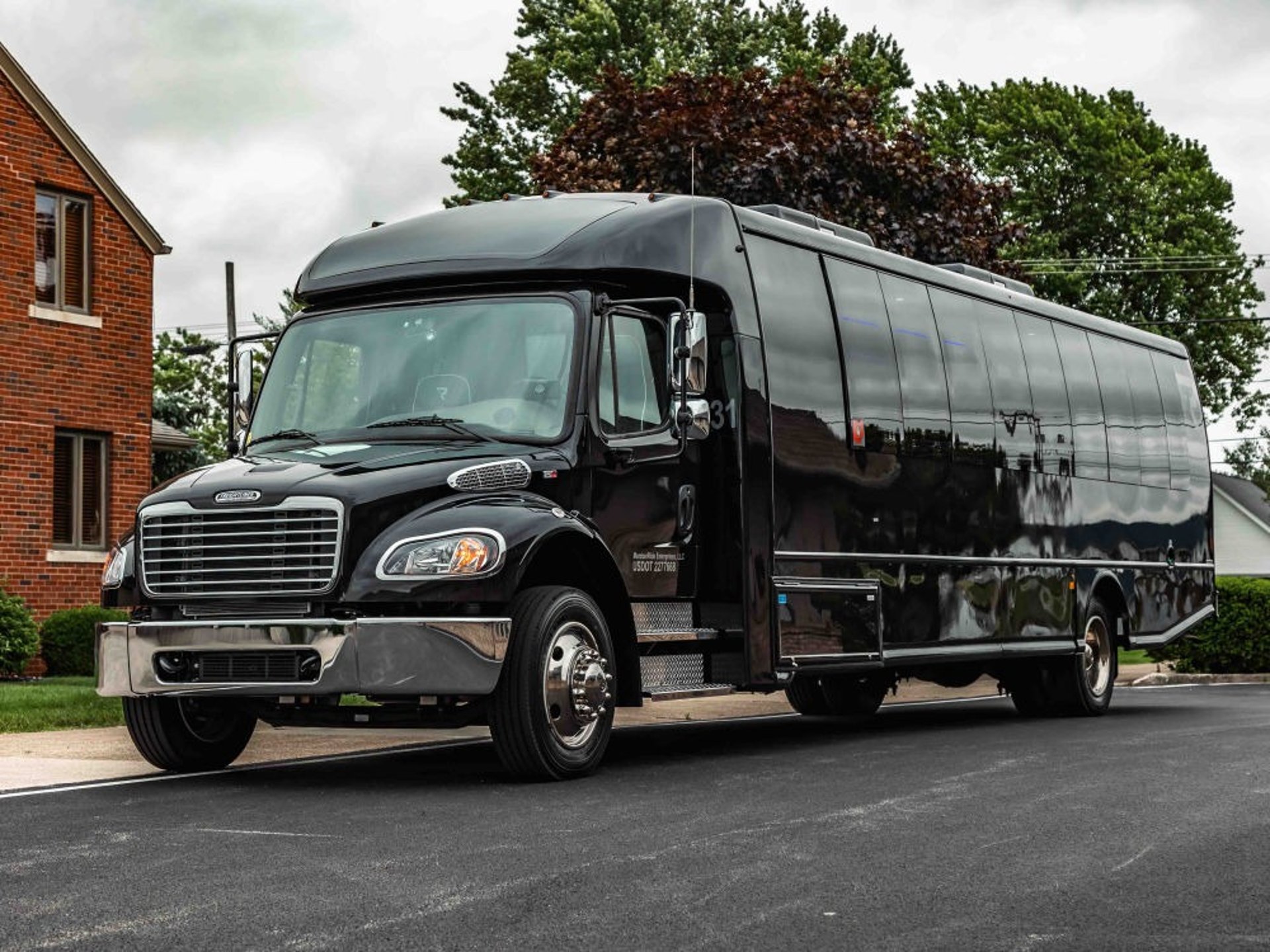 black and brown leather padded tub sofa
