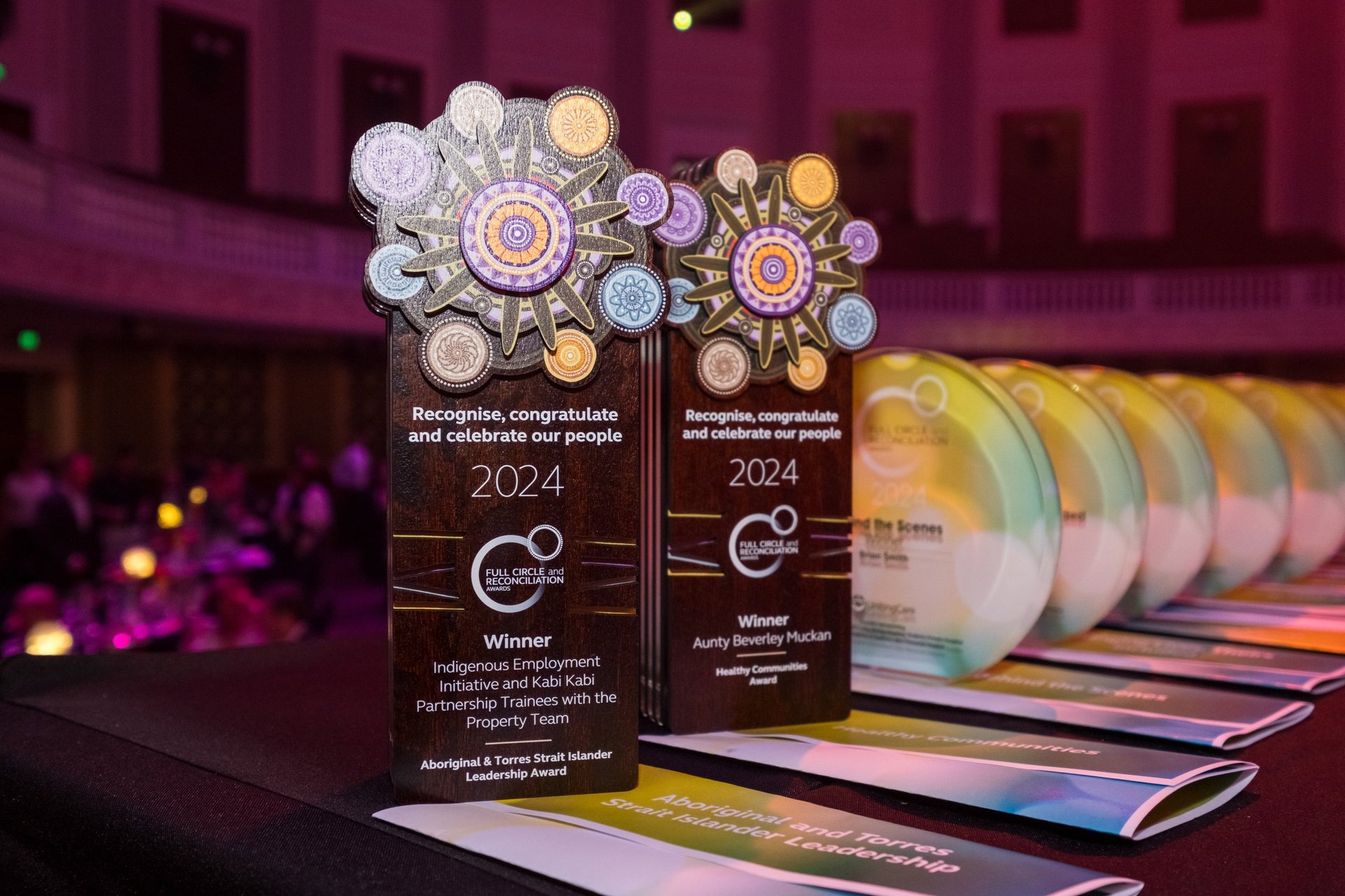 an abstract photo of a curved building with a blue sky in the background