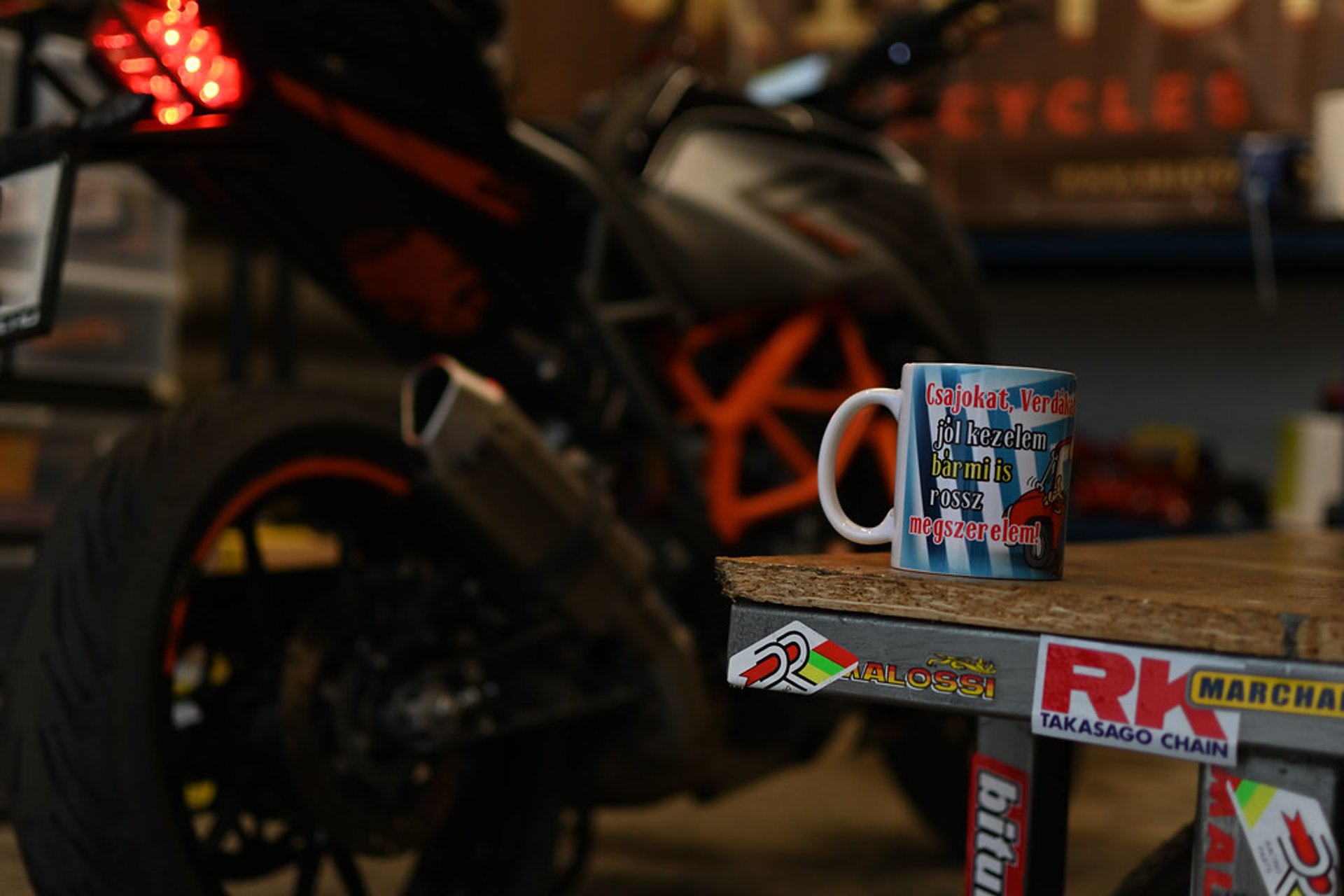 A close up of a motorcycle with a red white and blue stripe