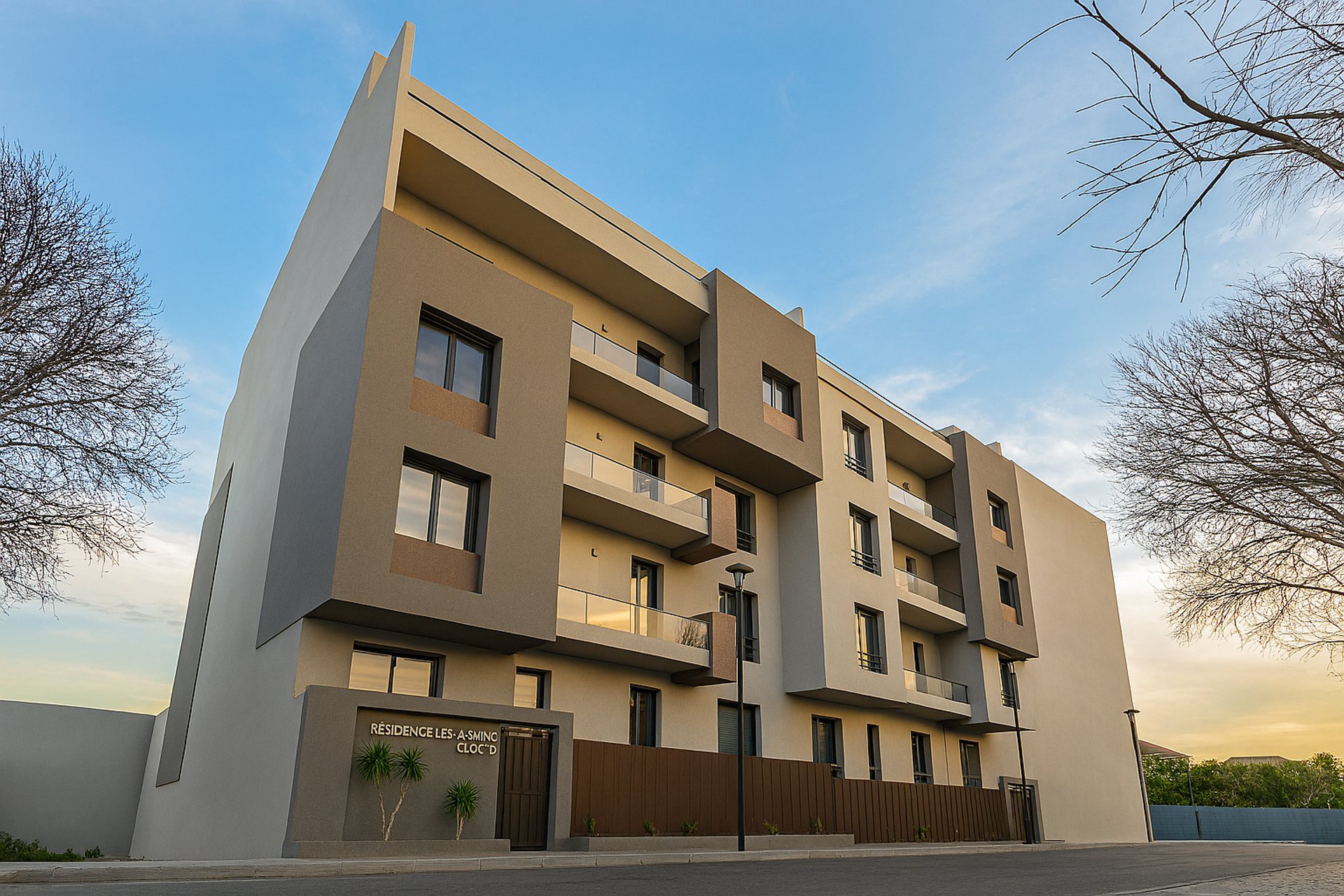 an abstract photo of a curved building with a blue sky in the background