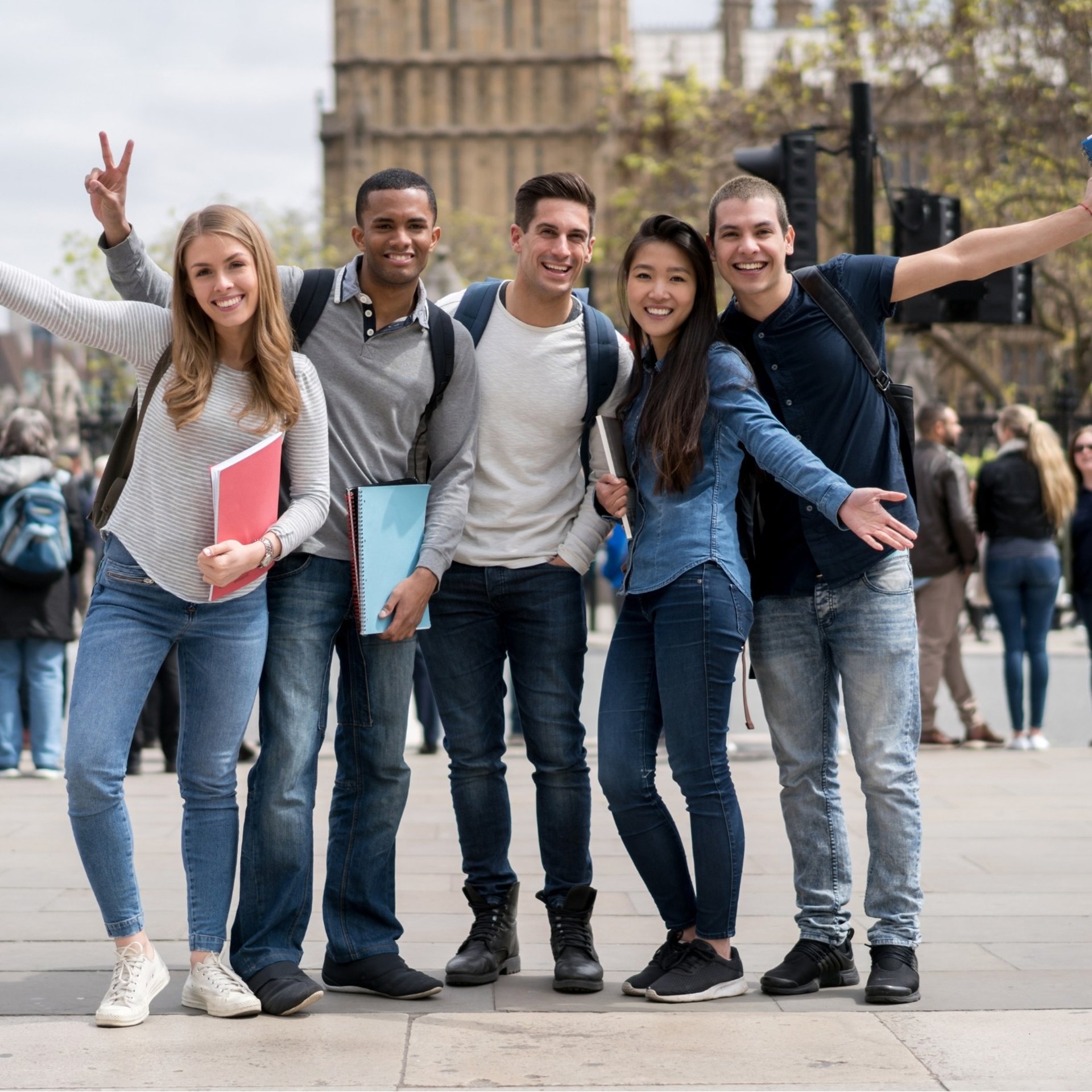 man standing on gray bridge while carrying a man during daytime