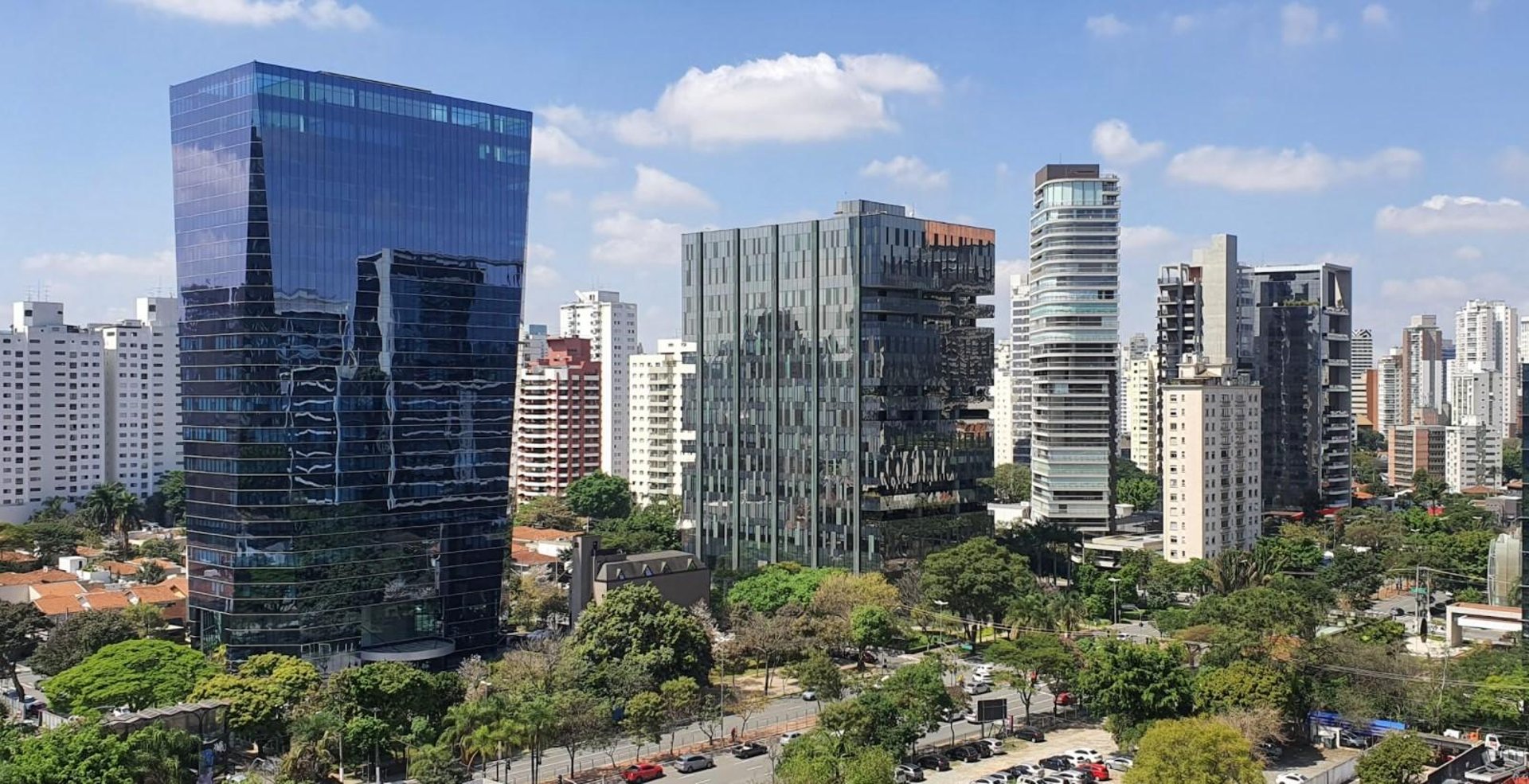 woman wearing yellow long-sleeved dress under white clouds and blue sky during daytime