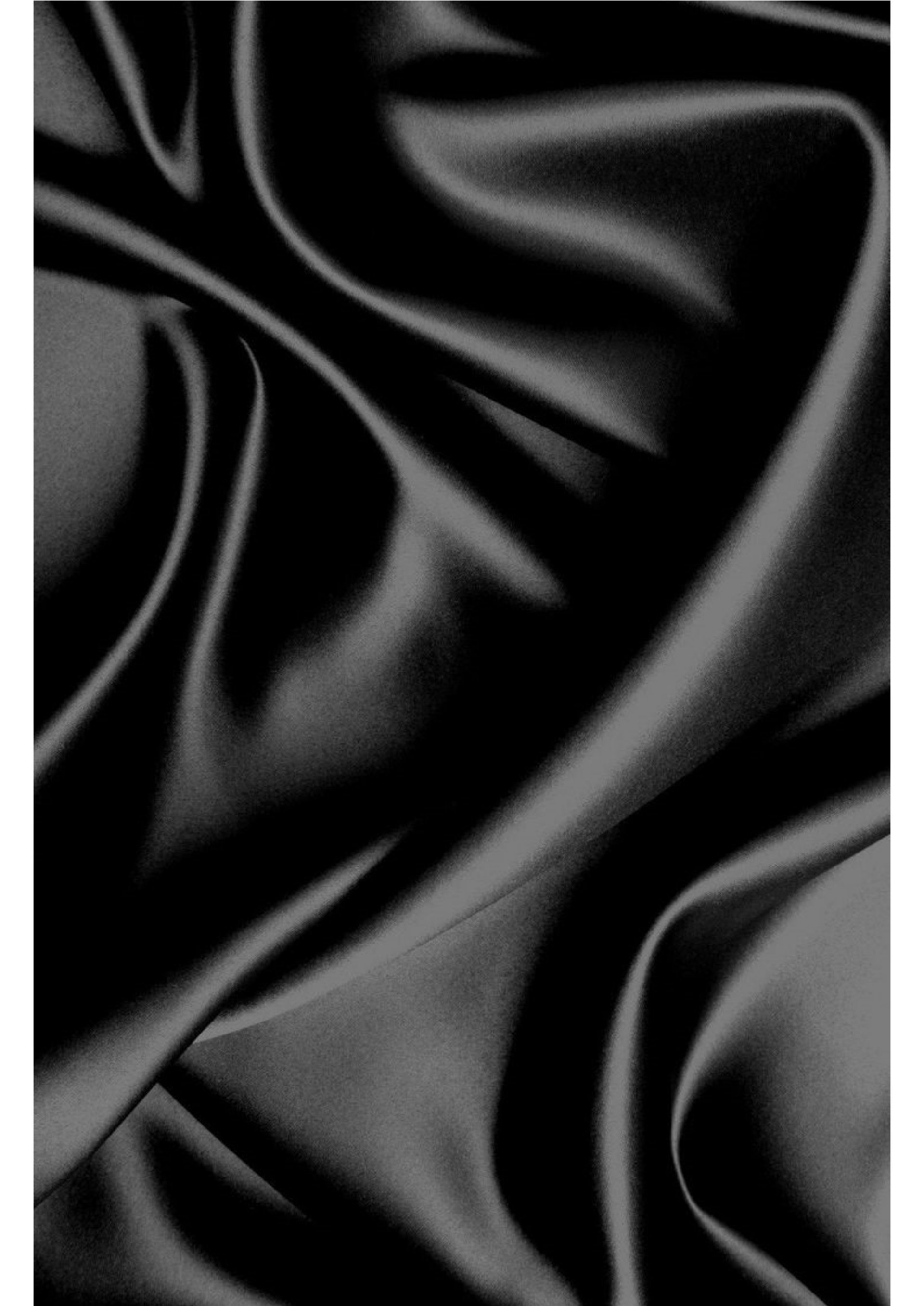 a close up of a black and brown abstract painting