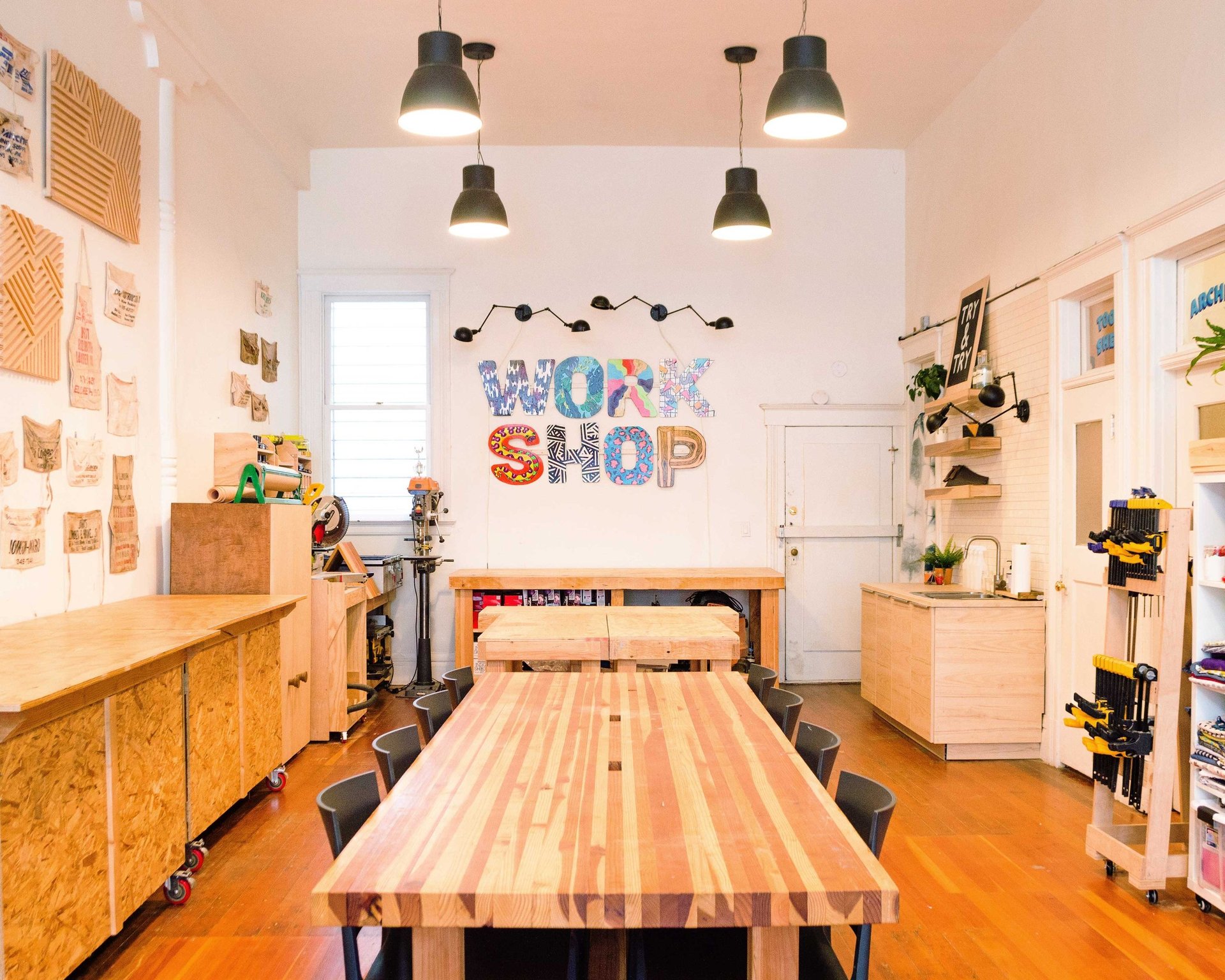 a bunch of books and a vase of flowers on a table