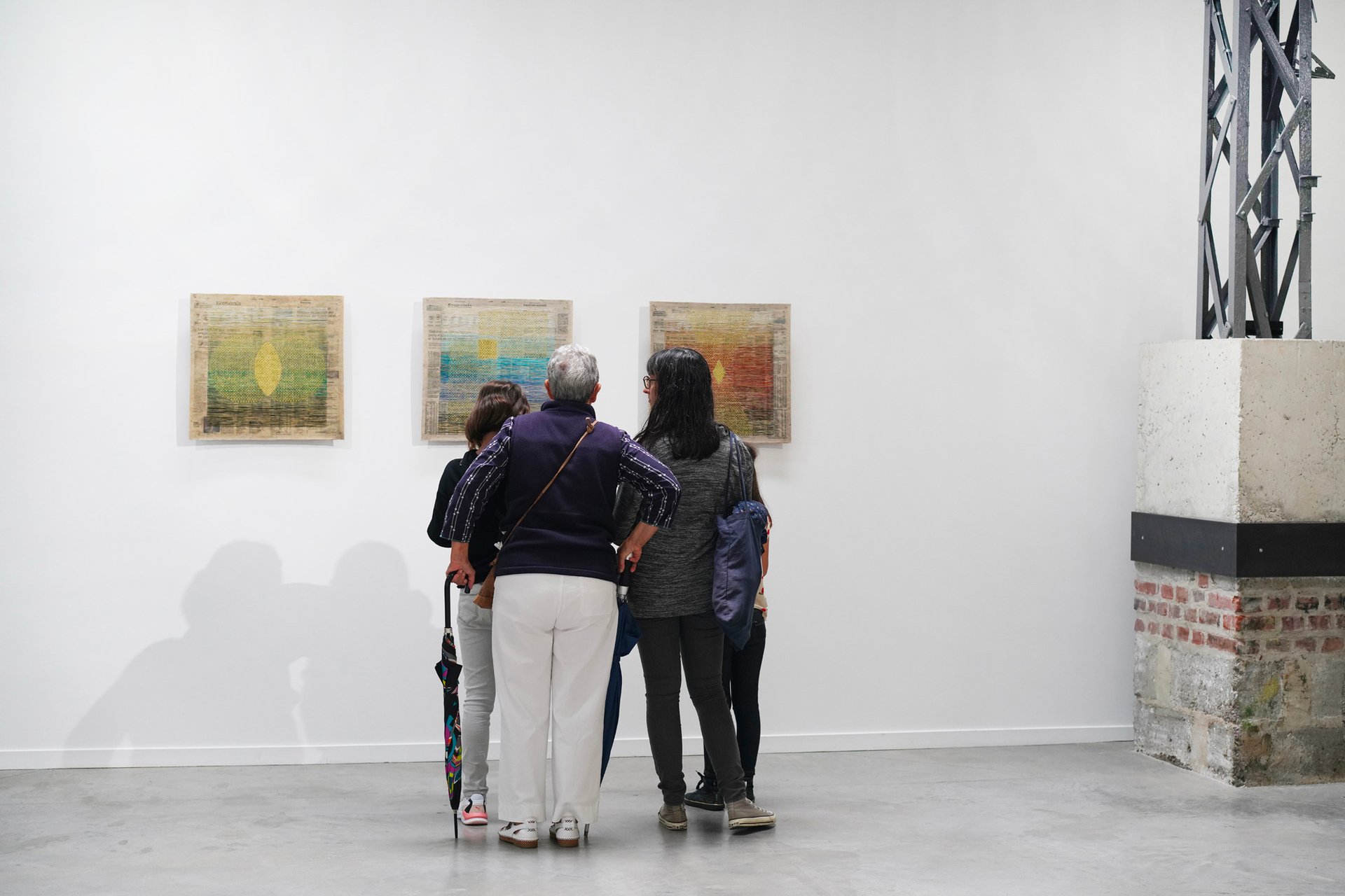 an abstract photo of a curved building with a blue sky in the background