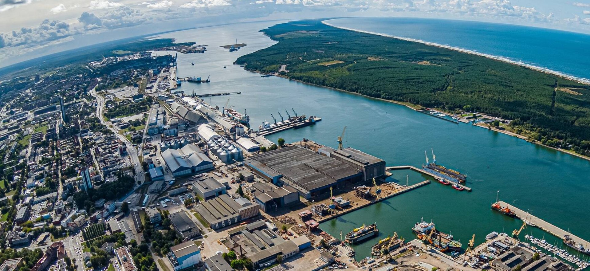 woman wearing yellow long-sleeved dress under white clouds and blue sky during daytime