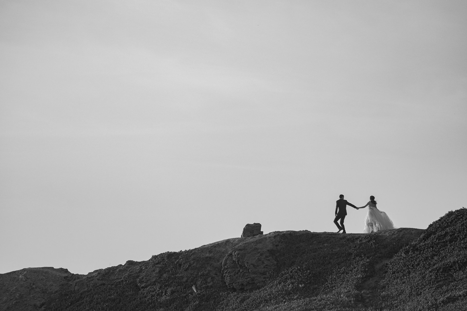 couple wearing silver-colored rings