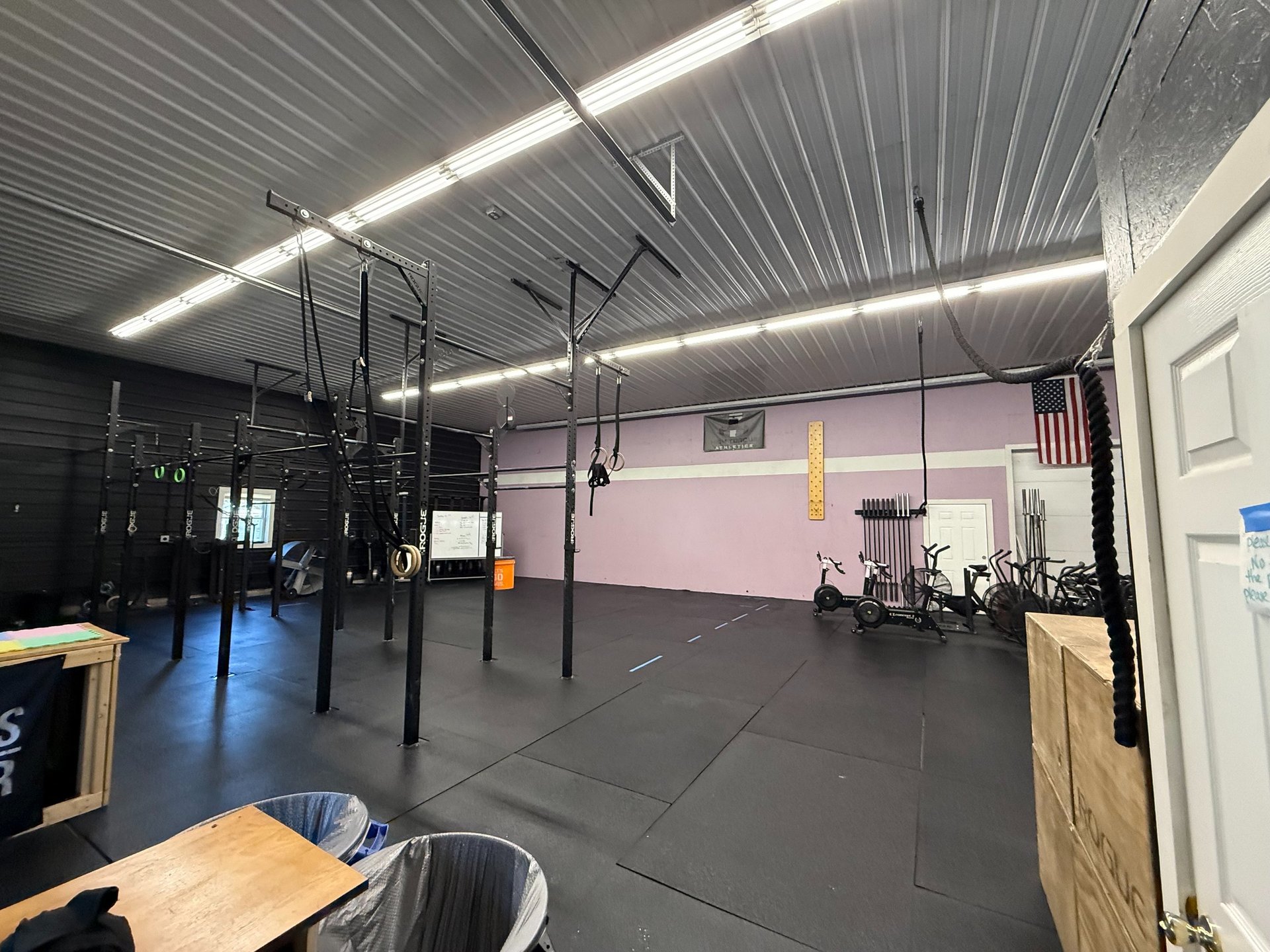 Helicopter and soldiers rappelling down a rope.