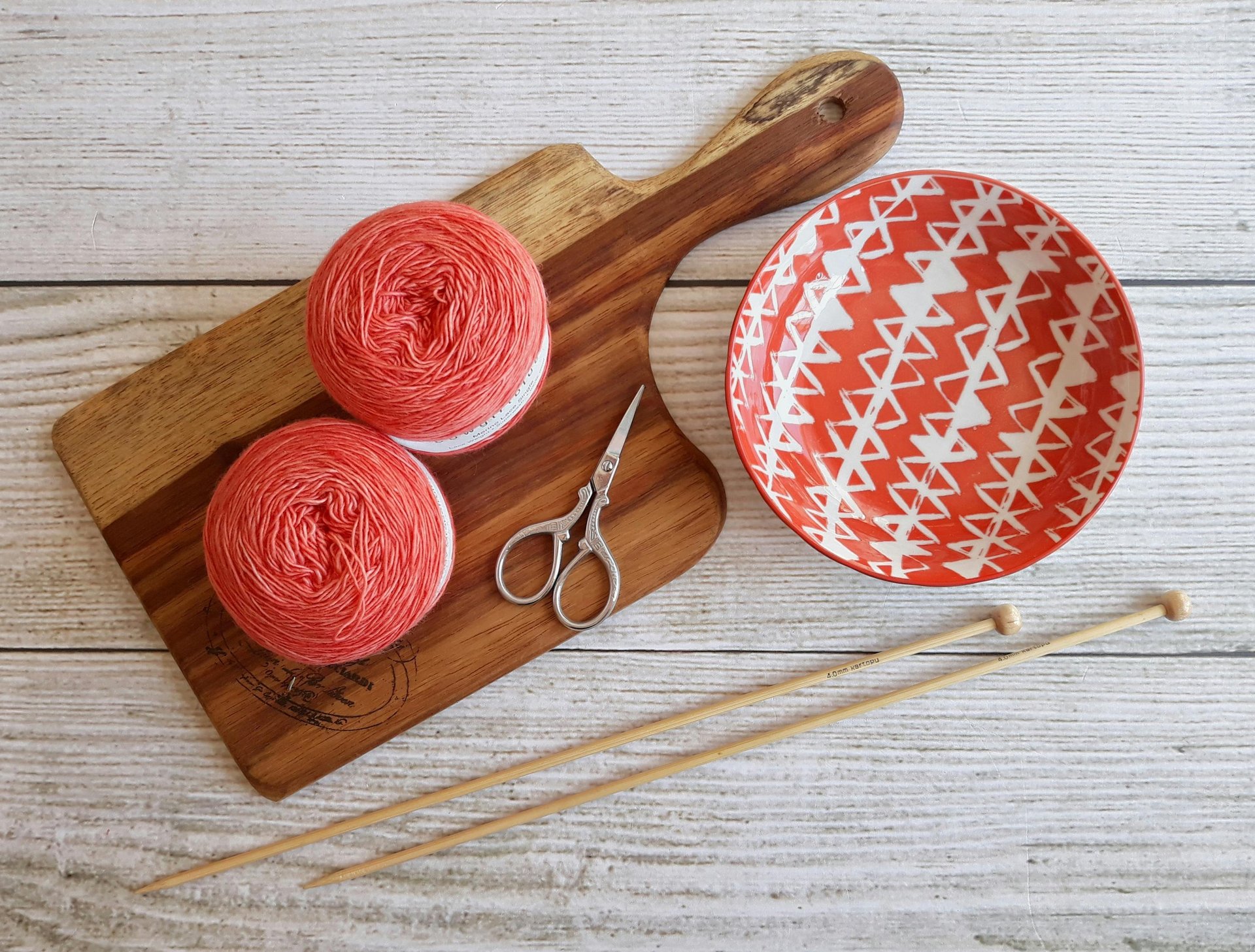 blue and red yarn on white surface