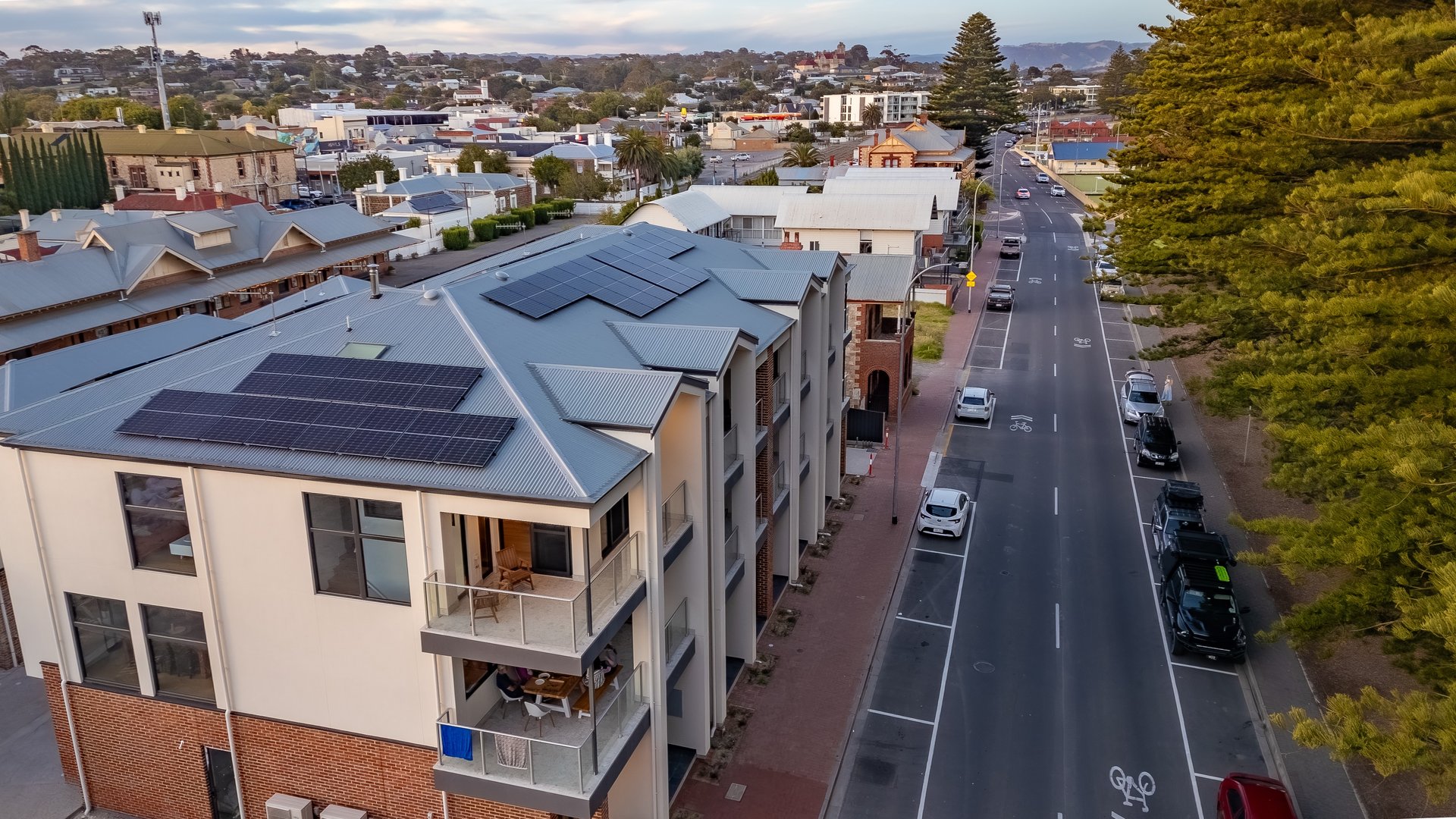 an abstract photo of a curved building with a blue sky in the background