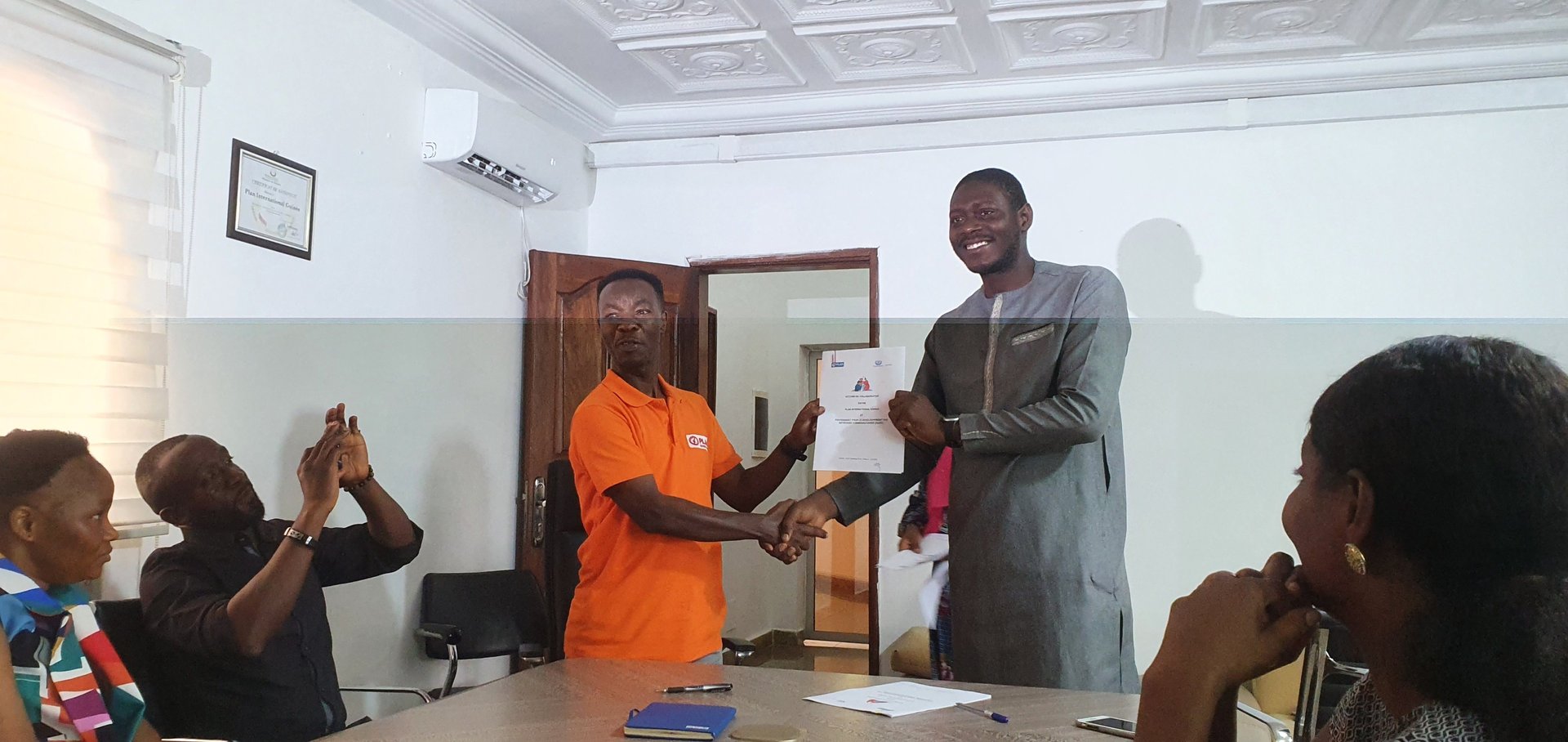 man and woman standing in front of brown concrete building during daytime