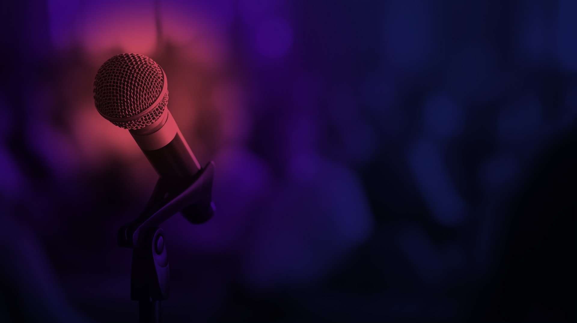 an abstract photo of a curved building with a blue sky in the background
