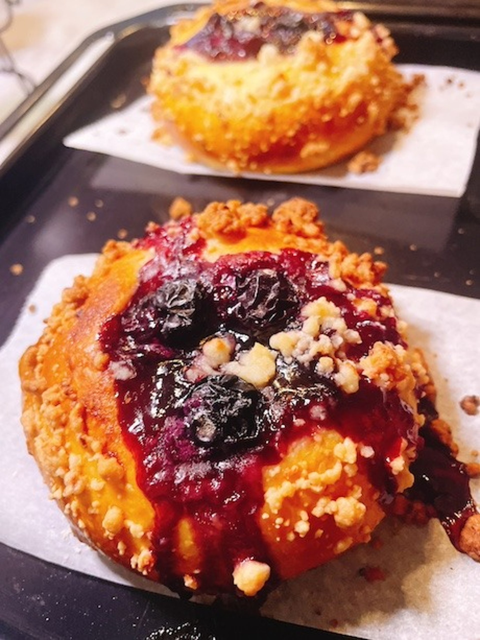 two bagels sitting on top of a piece of paper