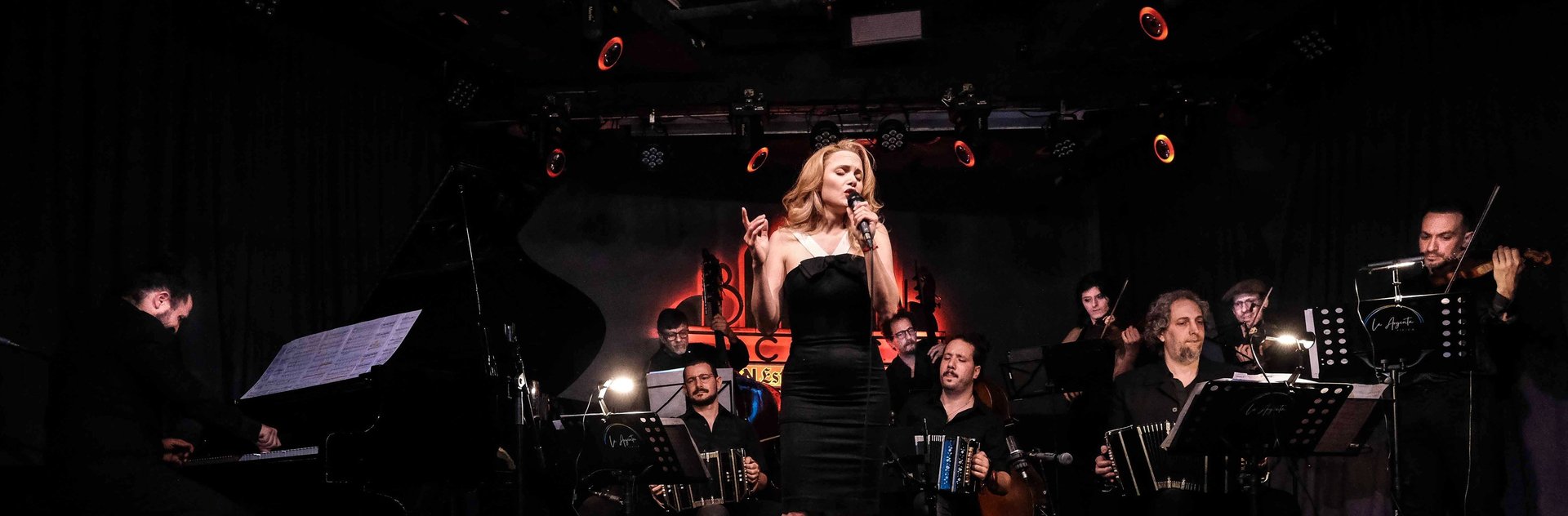 woman wearing yellow long-sleeved dress under white clouds and blue sky during daytime