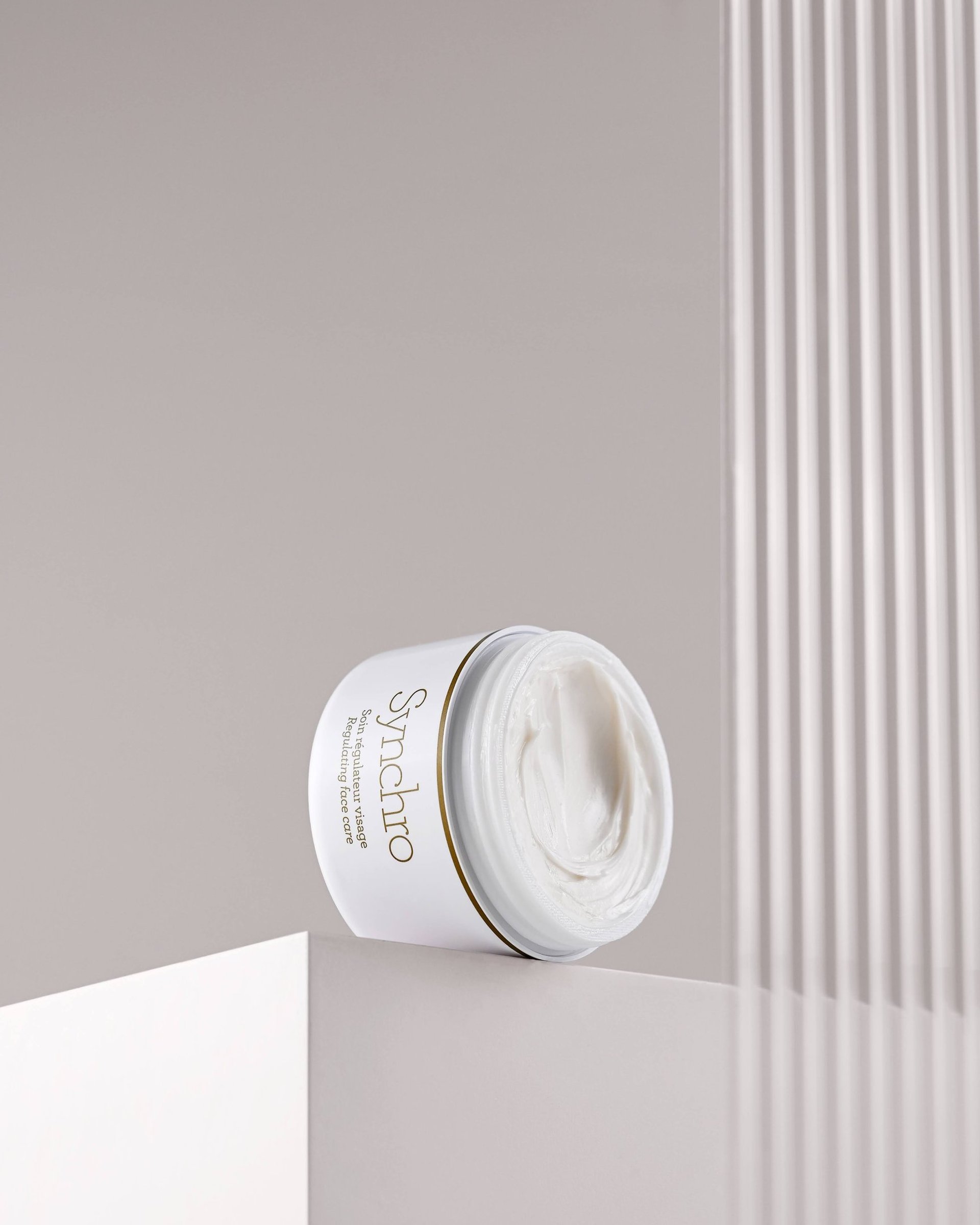 an abstract photo of a curved building with a blue sky in the background