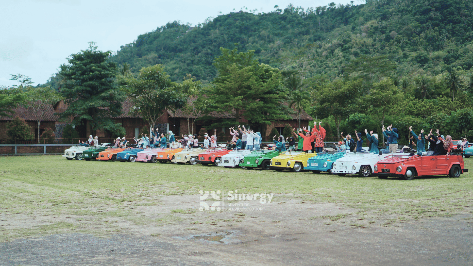 a group of people riding on the back of four wheelers